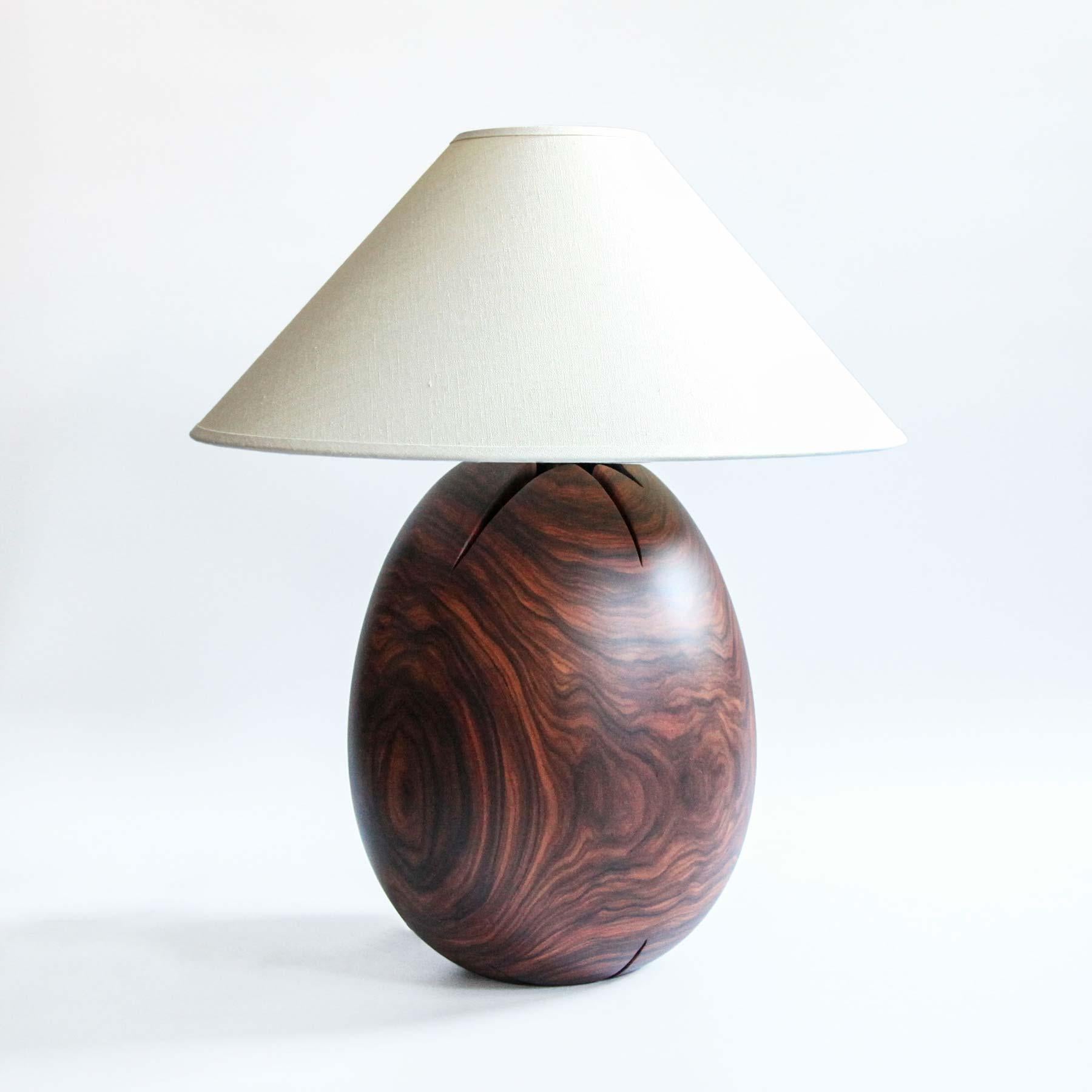 The Árbol collection is an embrace of tropical modernism; each lamp is composed of salvaged tropical hardwoods from the Bolivian city of Santa Cruz, where trees that are felled by natural causes—or for construction—are rescued by our team. A blend