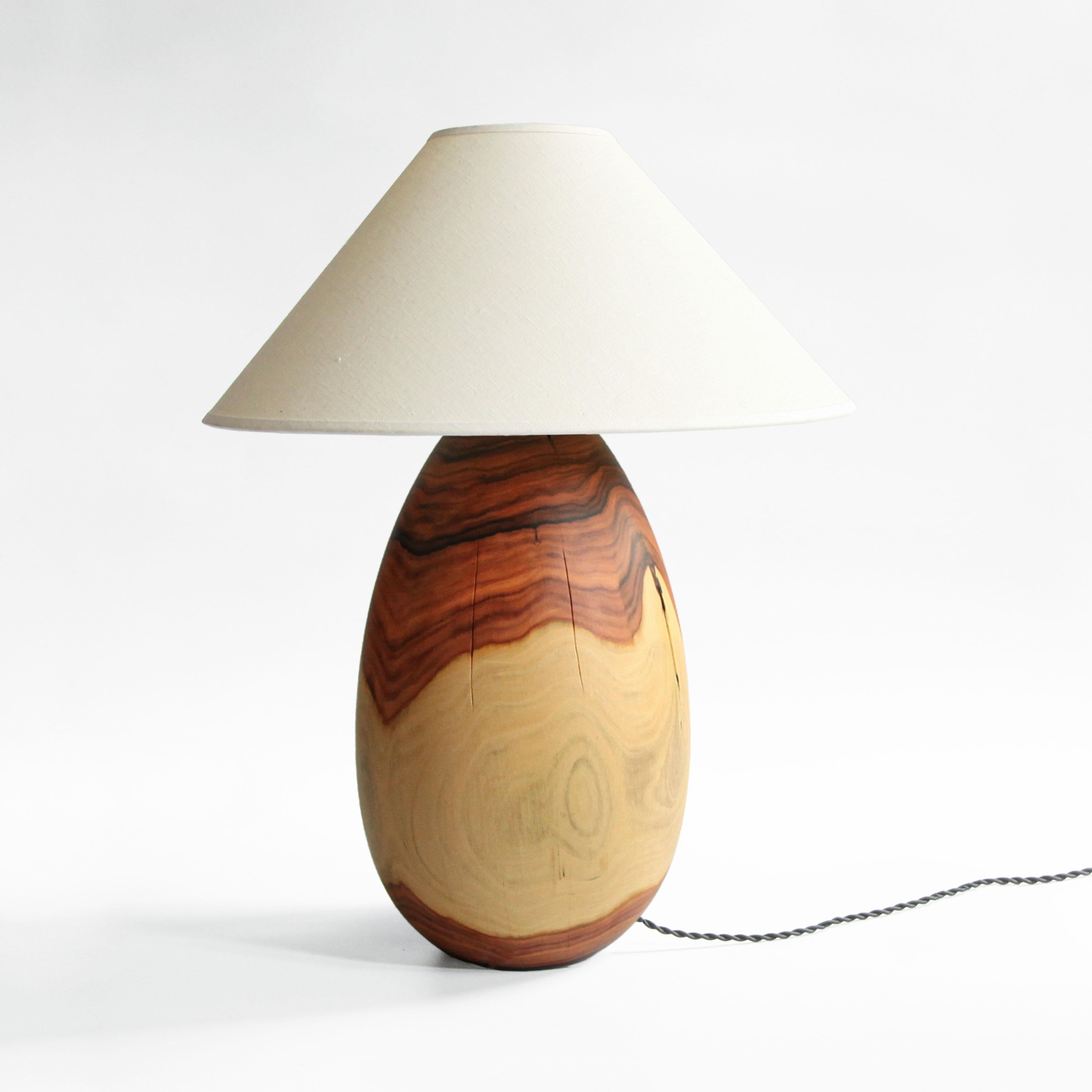 The Árbol collection is an embrace of tropical modernism; each lamp is composed of salvaged tropical hardwoods from the Bolivian city of Santa Cruz, where trees that are felled by natural causes-or for construction-are rescued by our team. A blend