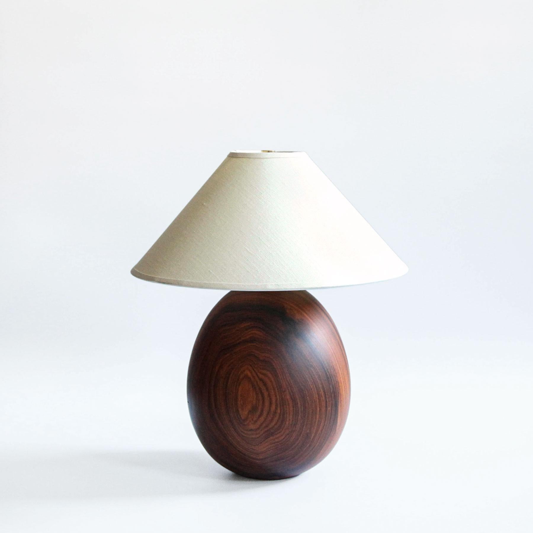 The Árbol collection is an embrace of tropical modernism, each lamp is composed of salvaged tropical hardwoods from the Bolivian city of Santa Cruz, where trees that are felled by natural causes—or for construction—are rescued by our team. A blend