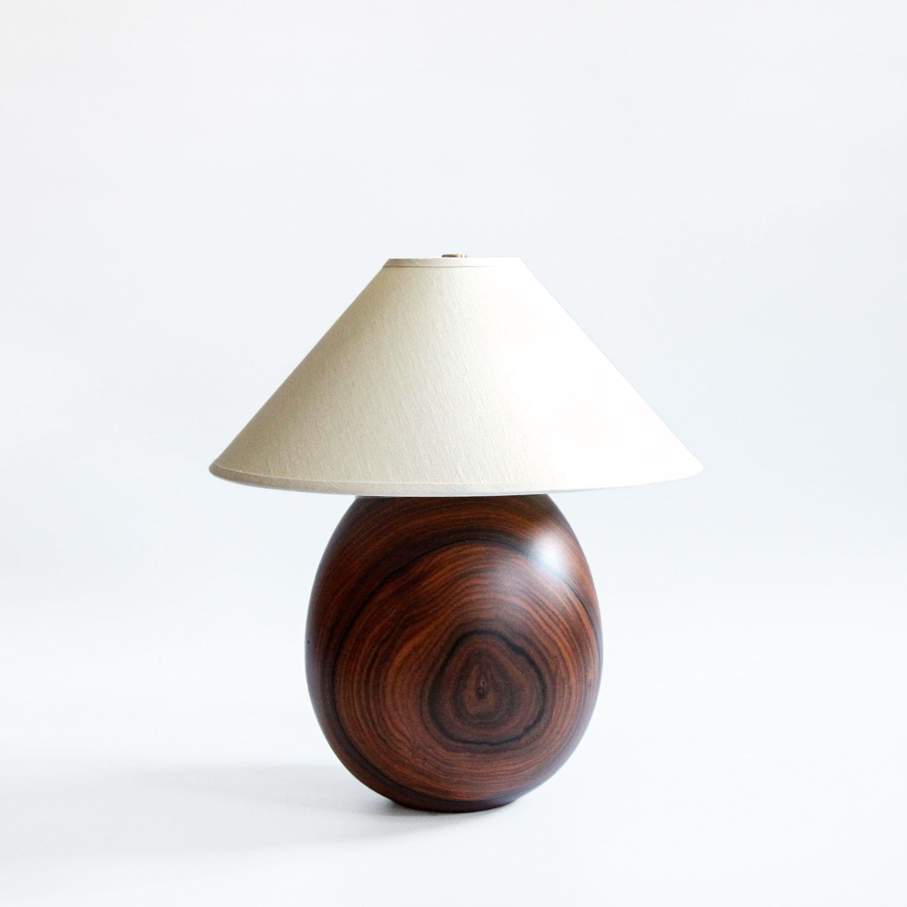 The Árbol collection is an embrace of tropical modernism; each lamp is composed of salvaged tropical hardwoods from the Bolivian city of Santa Cruz, where trees that are felled by natural causes—or for construction—are rescued by our team. A blend