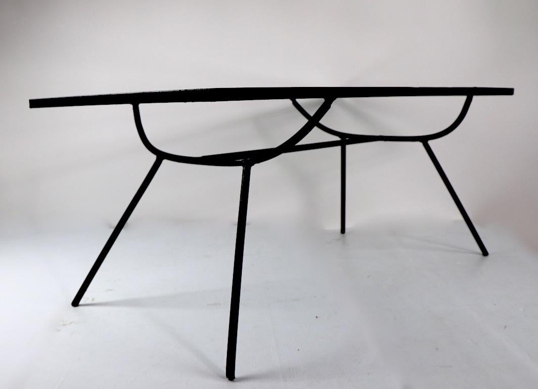 Rare George Nelson for Arbuck wrought iron coffee cocktail table with glass insert top. Originally designed for outdoor use, also suitable for indoor applications.
Hard to find form, recently repainted in semi gloss black finish. Classic