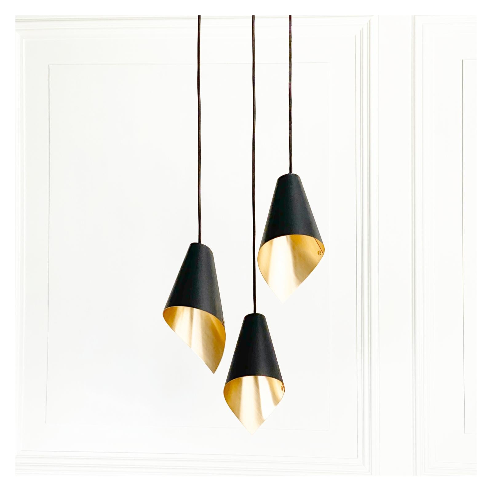 With a black external surface in contrast to its beautiful brushed brass interior, this beautiful ceiling light is from our ‘ARC’ range and can be used in many different configurations to stunning effect. Hang pendant lights in singles or in rows to