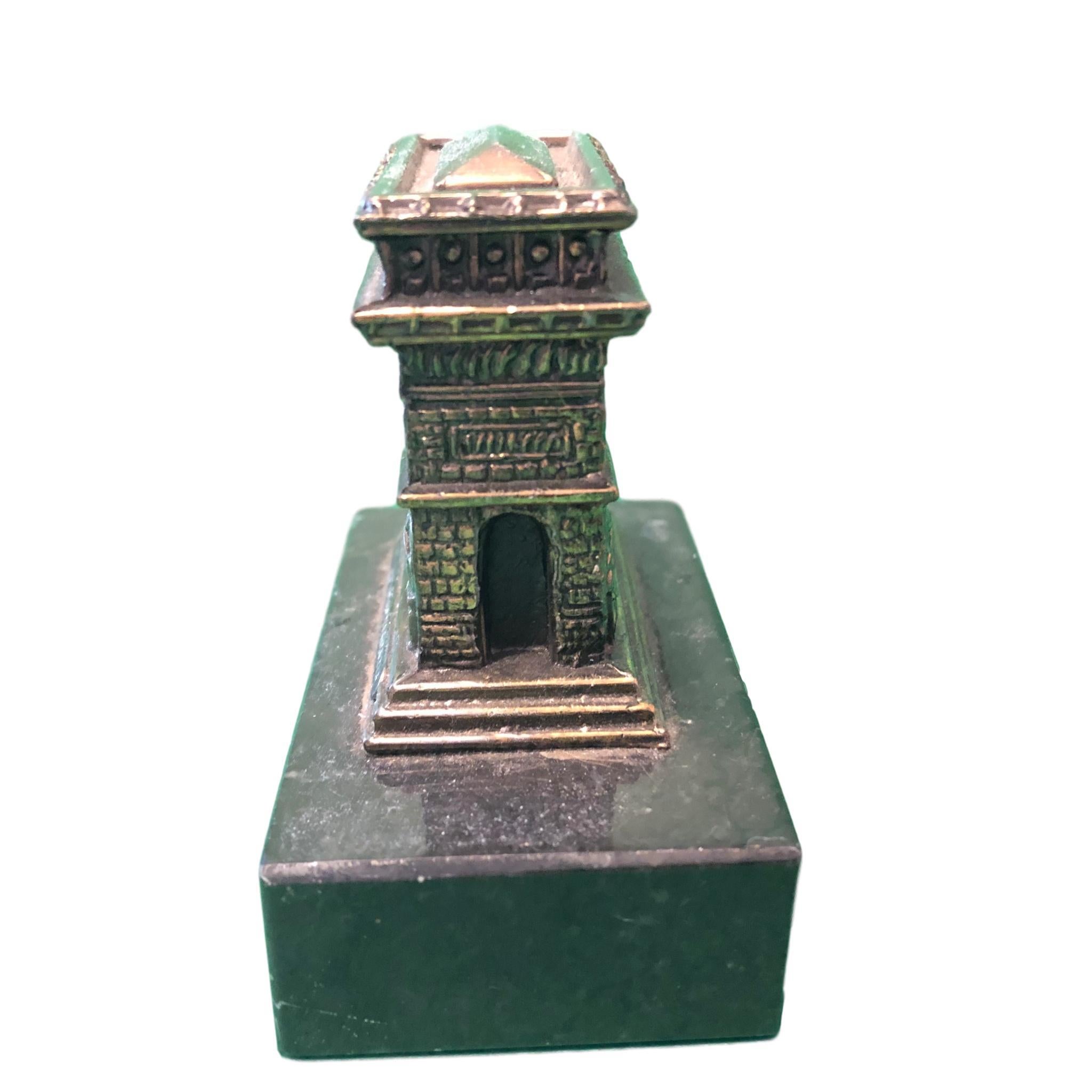 A Arc De Triomphe 1950s Souvenir building architectural model. Some wear with a nice patina, but this is old-age. Made of metal on a marble base. This was bought as a souvenir in Paris, France. A beautiful nice desktop item or just a display item in