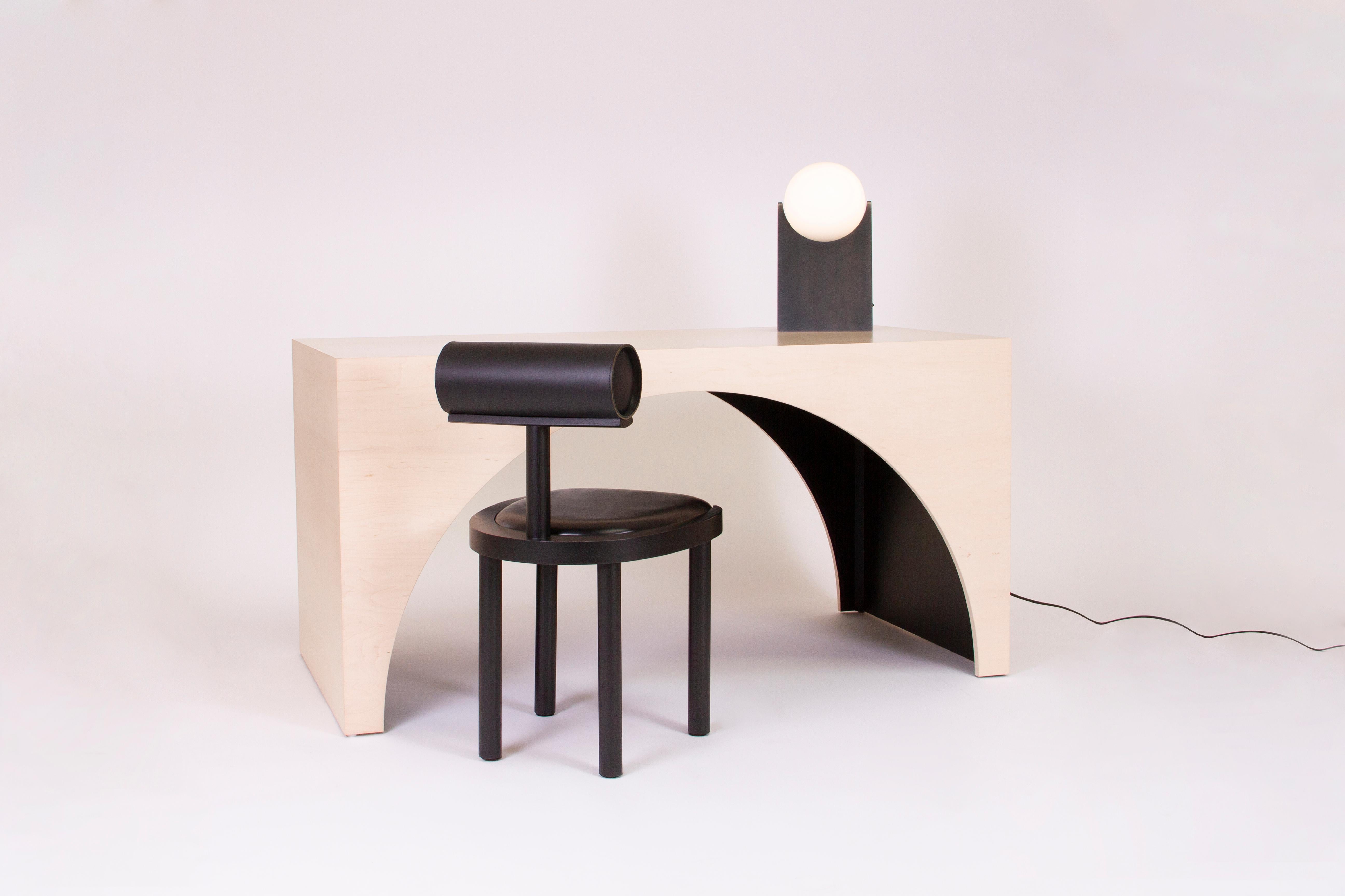 Arc desk made from wood with a bleached maple veneer finish and black stained interior.

Can also be used as a small dining table or wide console.

Designed and handmade in Los Angeles by Estudio Persona.