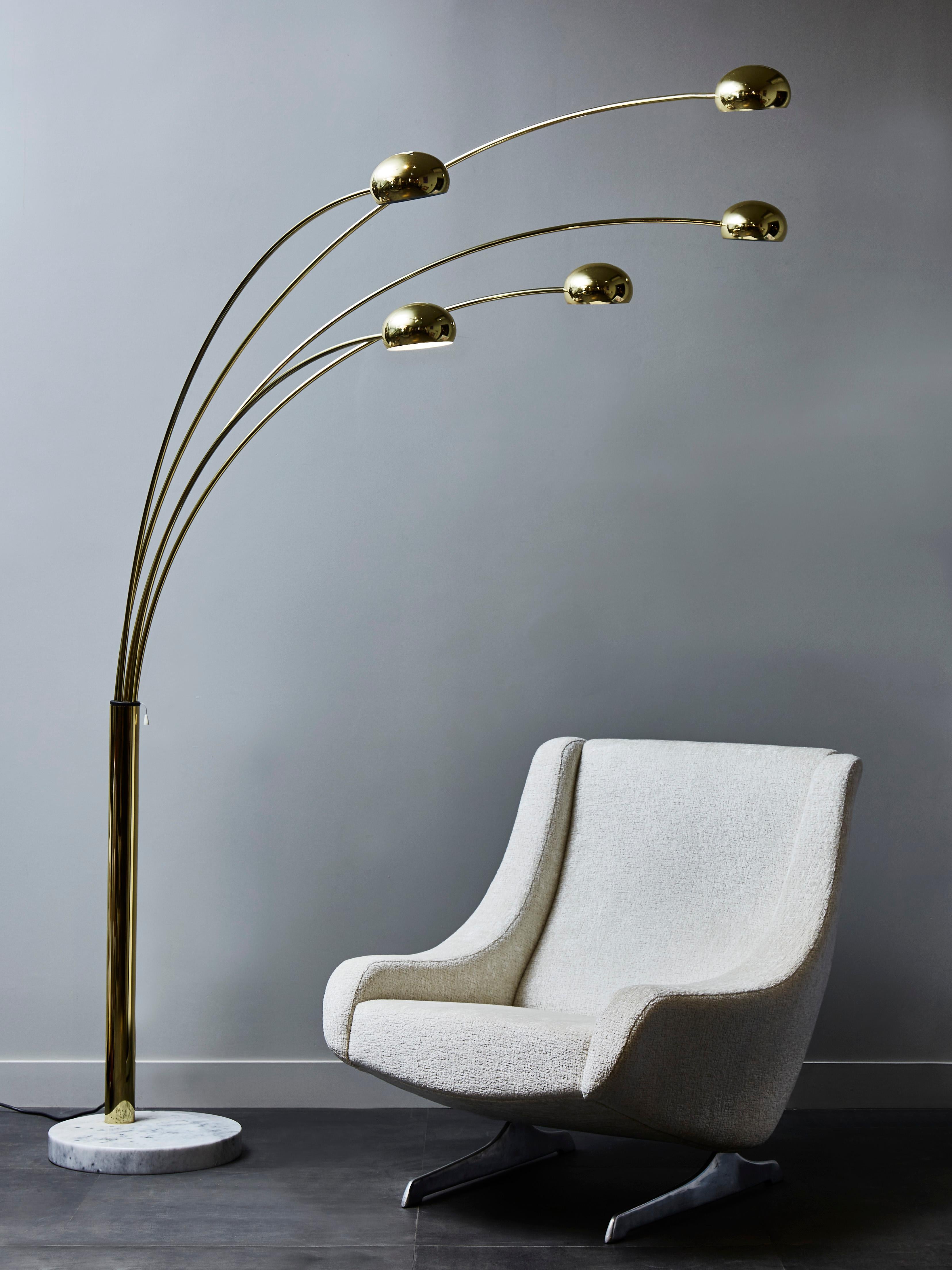 Swedish Arc floor lamp made of a white marble foot, brass body and arms. Each of the five arm is adjustable as well as the sconces holding the light bulbs.

Clever switch mechanism, allowing you to turn on either two, three or all