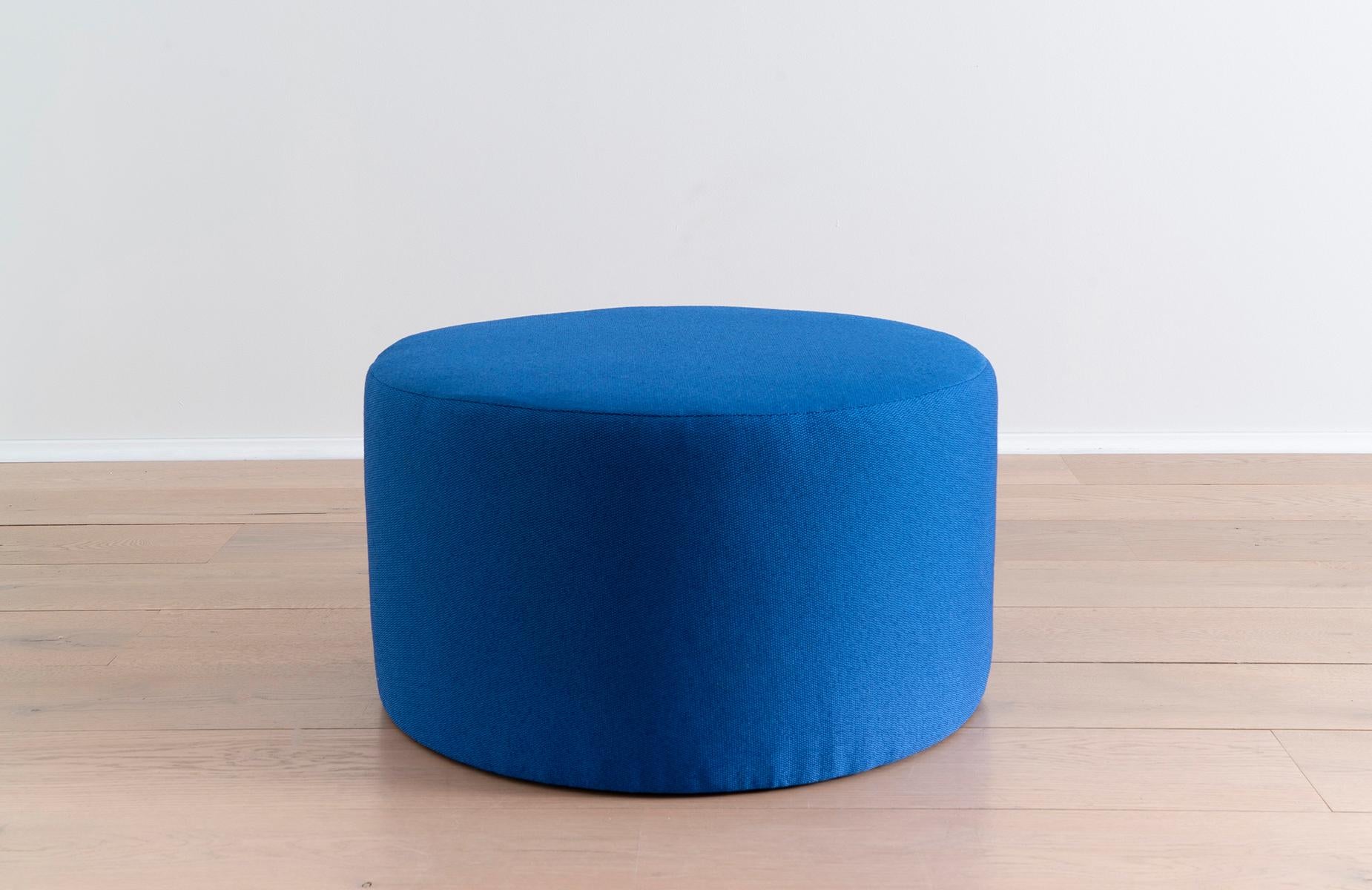 This blue ottoman pairs well with just about any sofa or lounge chair, while also offering versatility as a pouf, coffee or side table. Invite both color and a functional upgrade into any seating arrangement with this sculptural study in