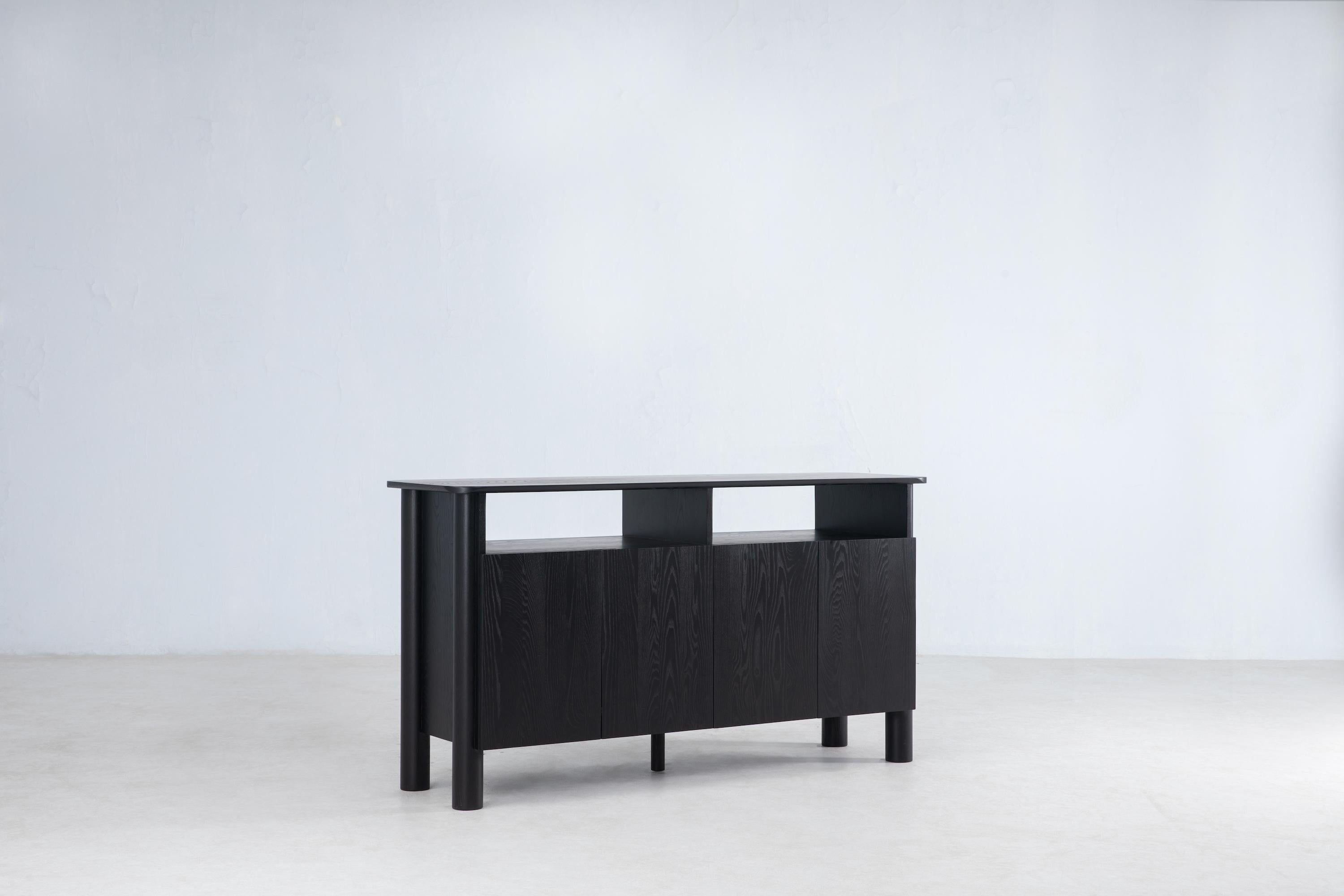 The Arc Sideboard ties the Arc collection's characteristic wide cylindrical legs and rounded edge detailing with ample storage space. Two mid-level shelves allow for multipurpose storage. The sideboard centers the experience on how it is to touch,