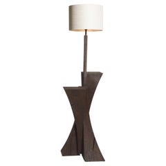 Arc - Solid oak floor standing lamp with twisting stem