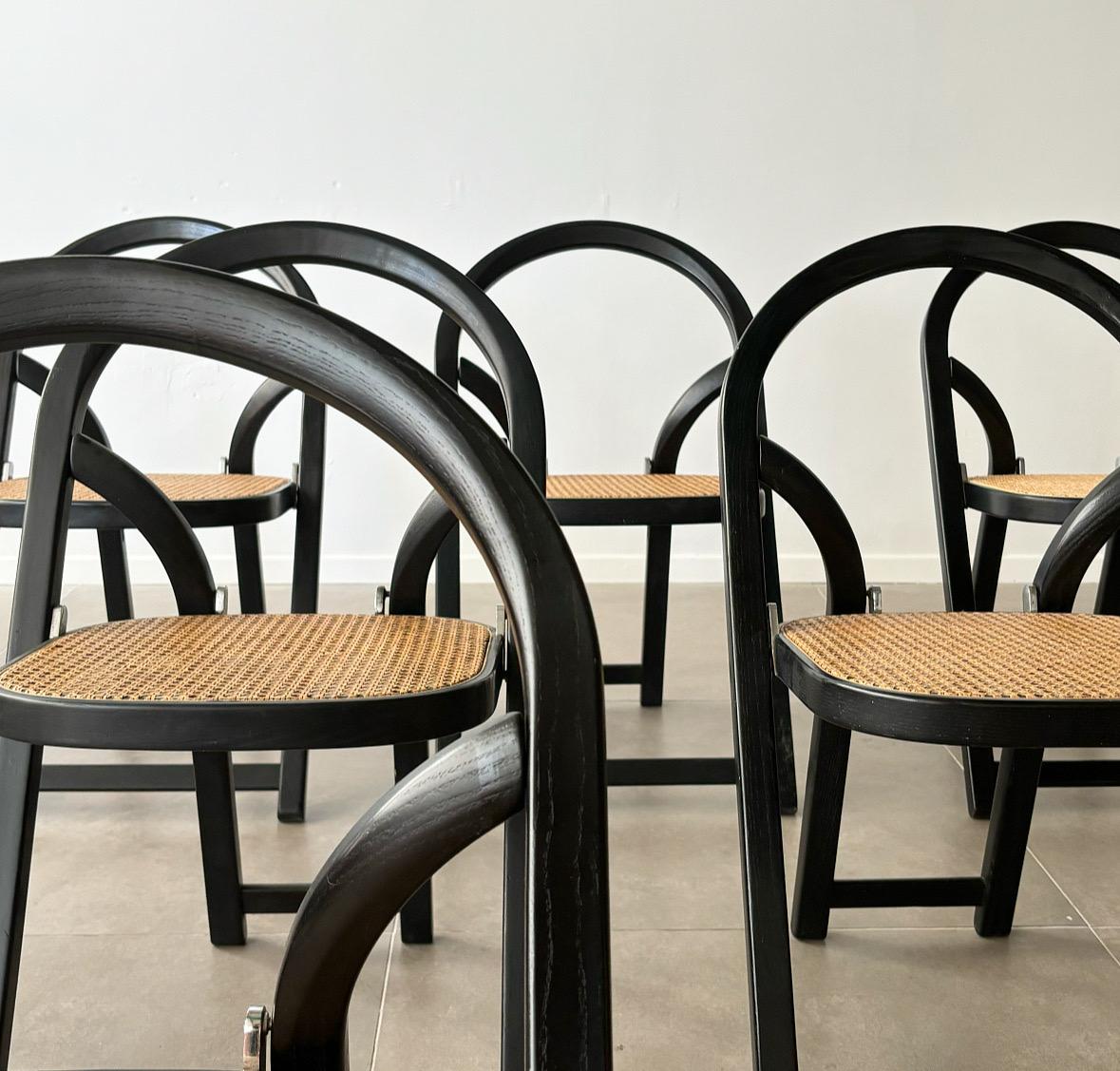 folding chairs in solid ash. Chromed folding mechanism. Cane in good condition. Arca by Gigi Sabadin created in 1974 for Crassevig.

Arca chair design by Gigi Sabadin in 1974. Crassevig edition.  Folding chair.  Structure in black lacquered solid