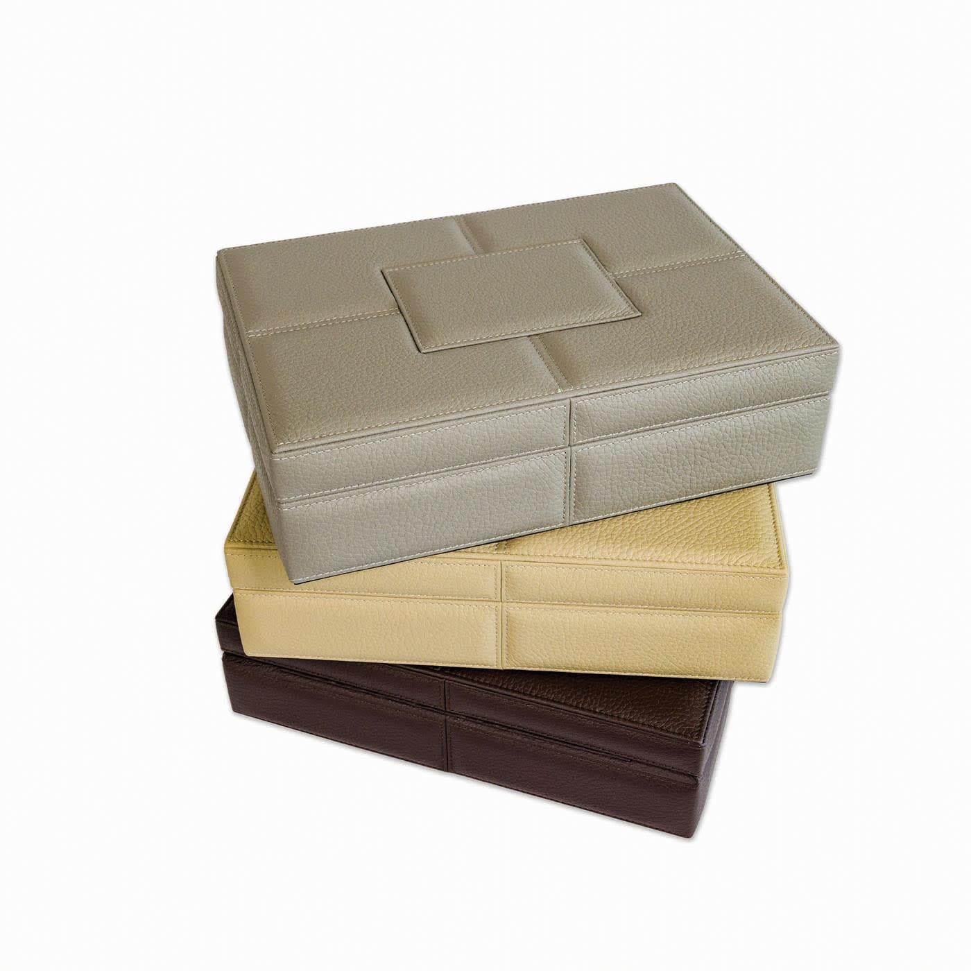 Wooden handmade box, with plateau, dressed in fine and soft genuine leather and with decorative soft stitching and internal microfiber fabric. Available in 14 different colors. Please, ask the Concierge for further details.

