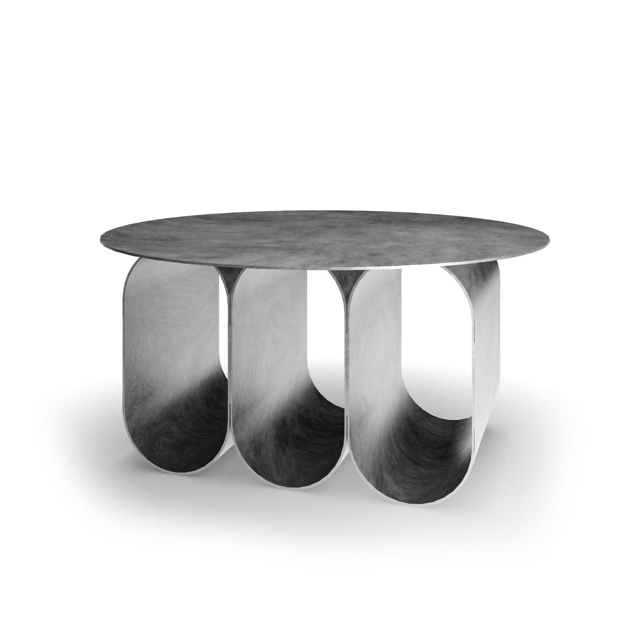 The Arcade coffee table - 3 arches round version - natural silver, has been created By Kasadamo in collaboration with Pierre Tassin, french designer. This table reflects a mix between old and futuristic architecture. Its identity is found in the