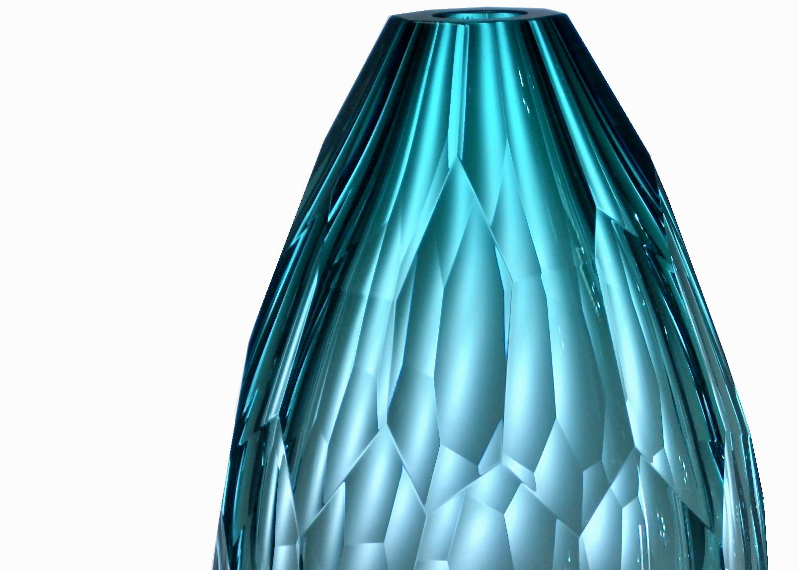 Euro is a mouth, blown and hand shaped vase in aquamarine color, brilliant cut.
Edition of 99 unique pieces signed and numbered by Ivan Baj. Arcade art pieces are made by hand in our Murano atelier. Small differences of size or color are the best