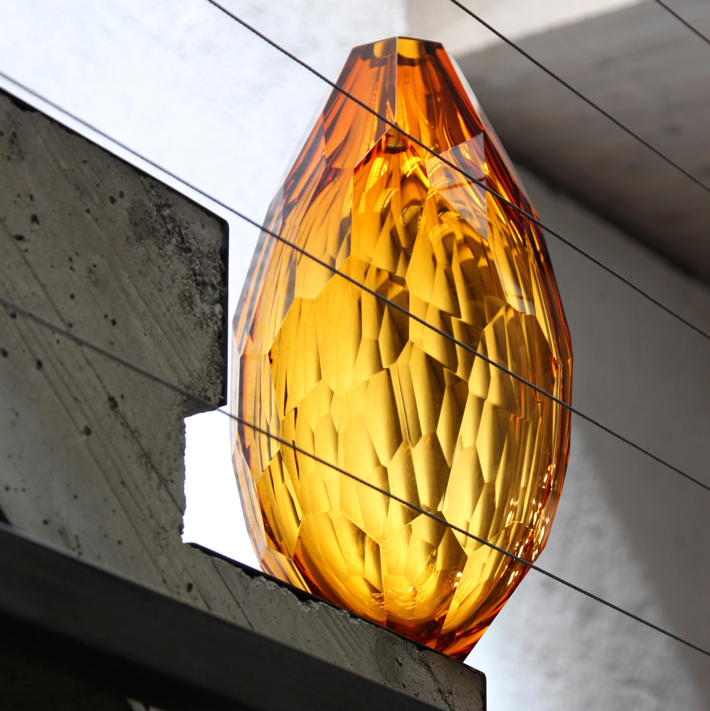 Euro is a mouth, blown and hand shaped vase in amber color, brilliant cut.
Edition of 99 unique pieces signed and numbered by Ivan Baj. Arcade art pieces are made by hand in our Murano atelier. Small differences of size or color are the best