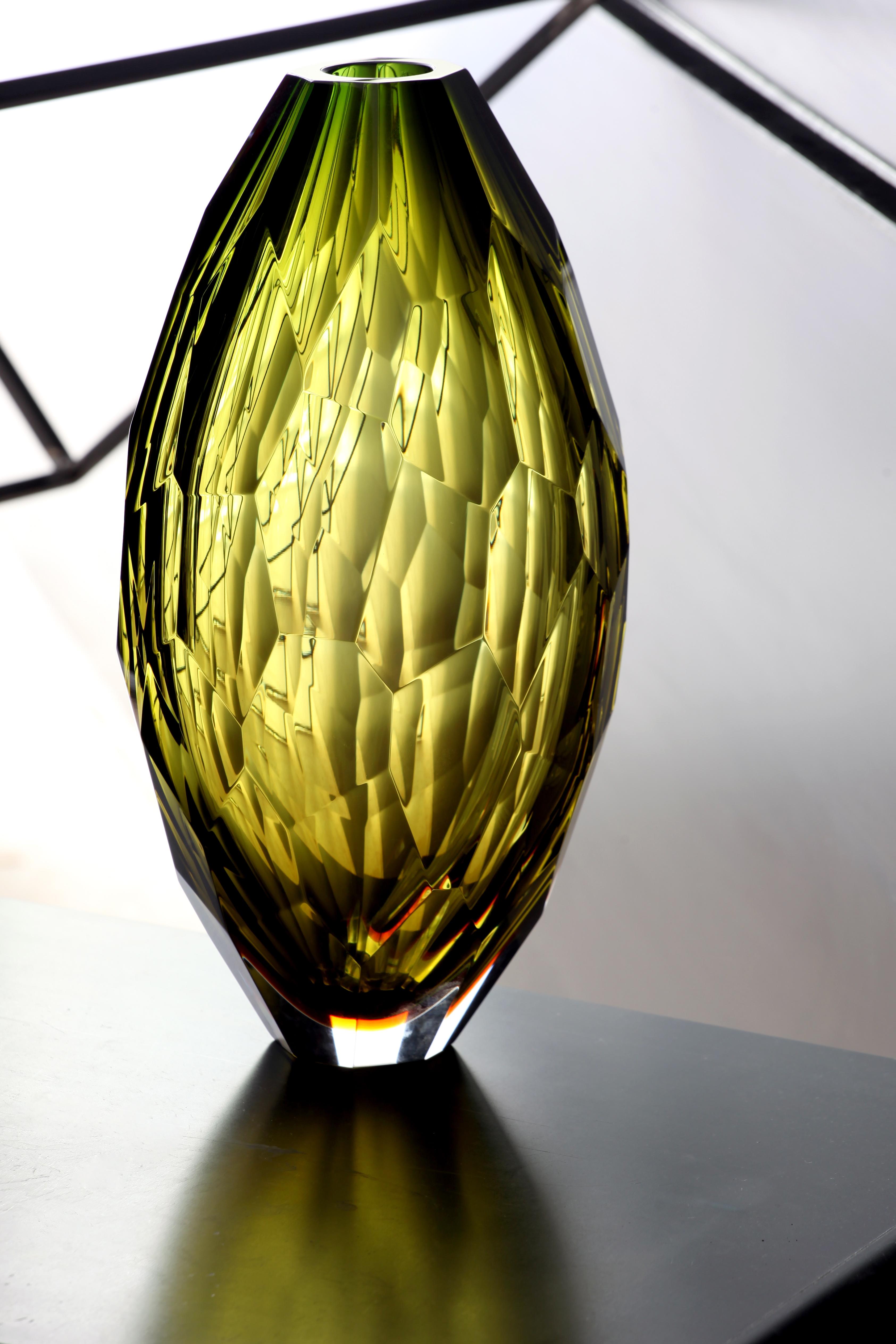 Euro is a mouth, blown and hand shaped vase in olive color, brilliant cut.
Edition of 99 unique pieces signed and numbered by Ivan Baj. Arcade art pieces are made by hand in our Murano atelier. Small differences of size or color are the best