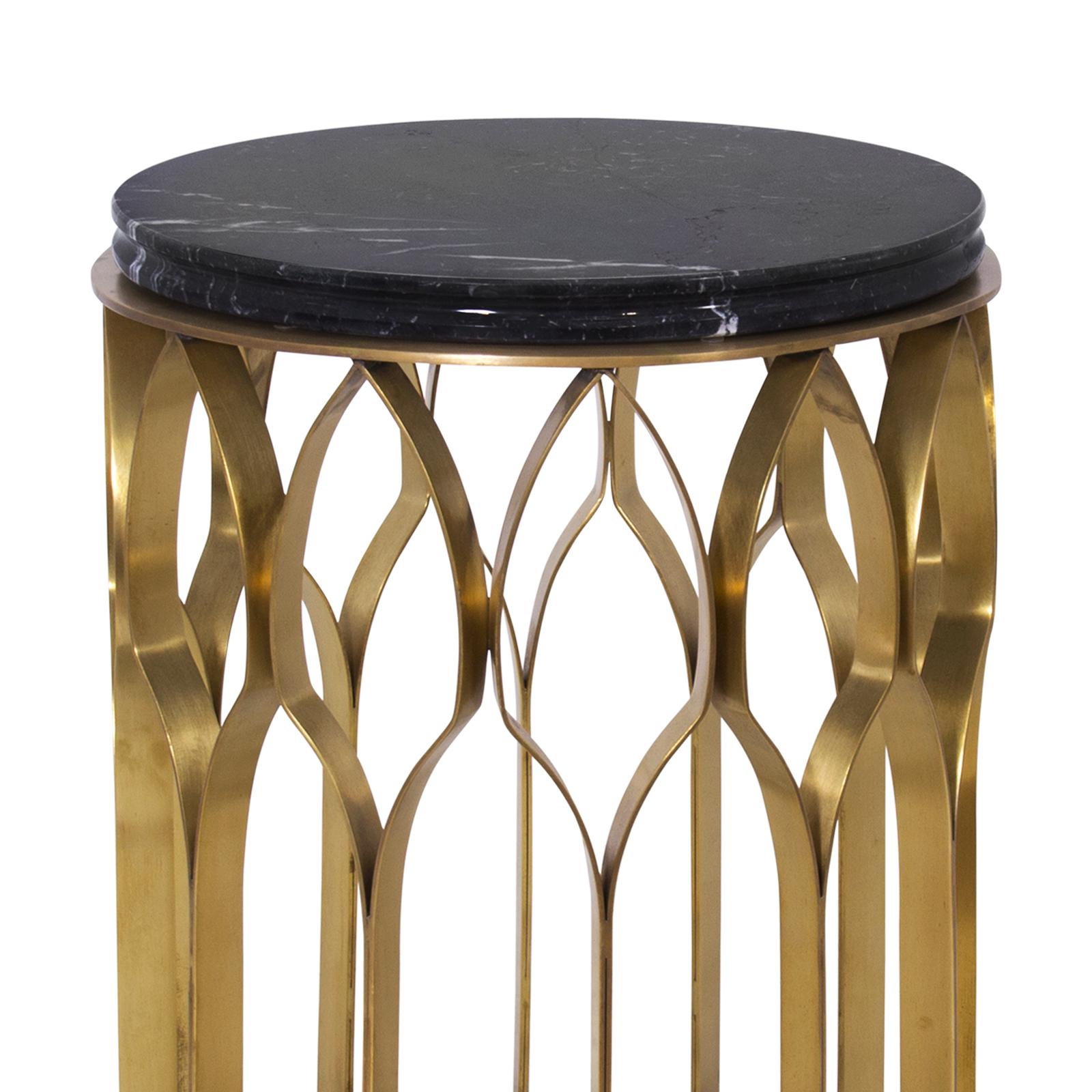 Round side table arcade with brushed aged
brass structure and marble Nero Marquina top.
 