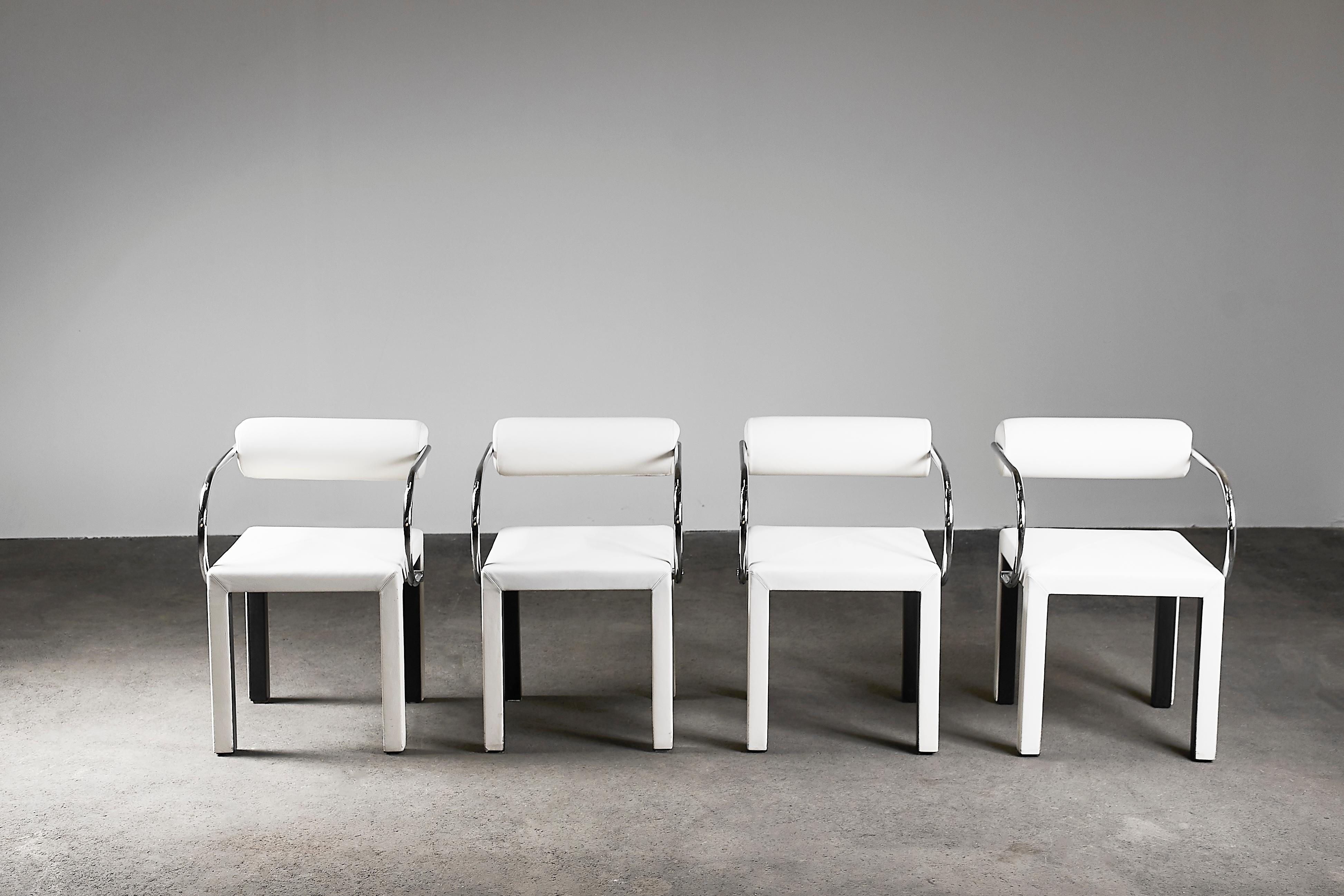 The most desirable of the Arcadia range. In chrome and white leather these chairs really pop, exuding timeless Mid-Century Modern style and panache. This design by Paolo Piva for B&B Italia in the 1980s in bent tube steel and geometric leather