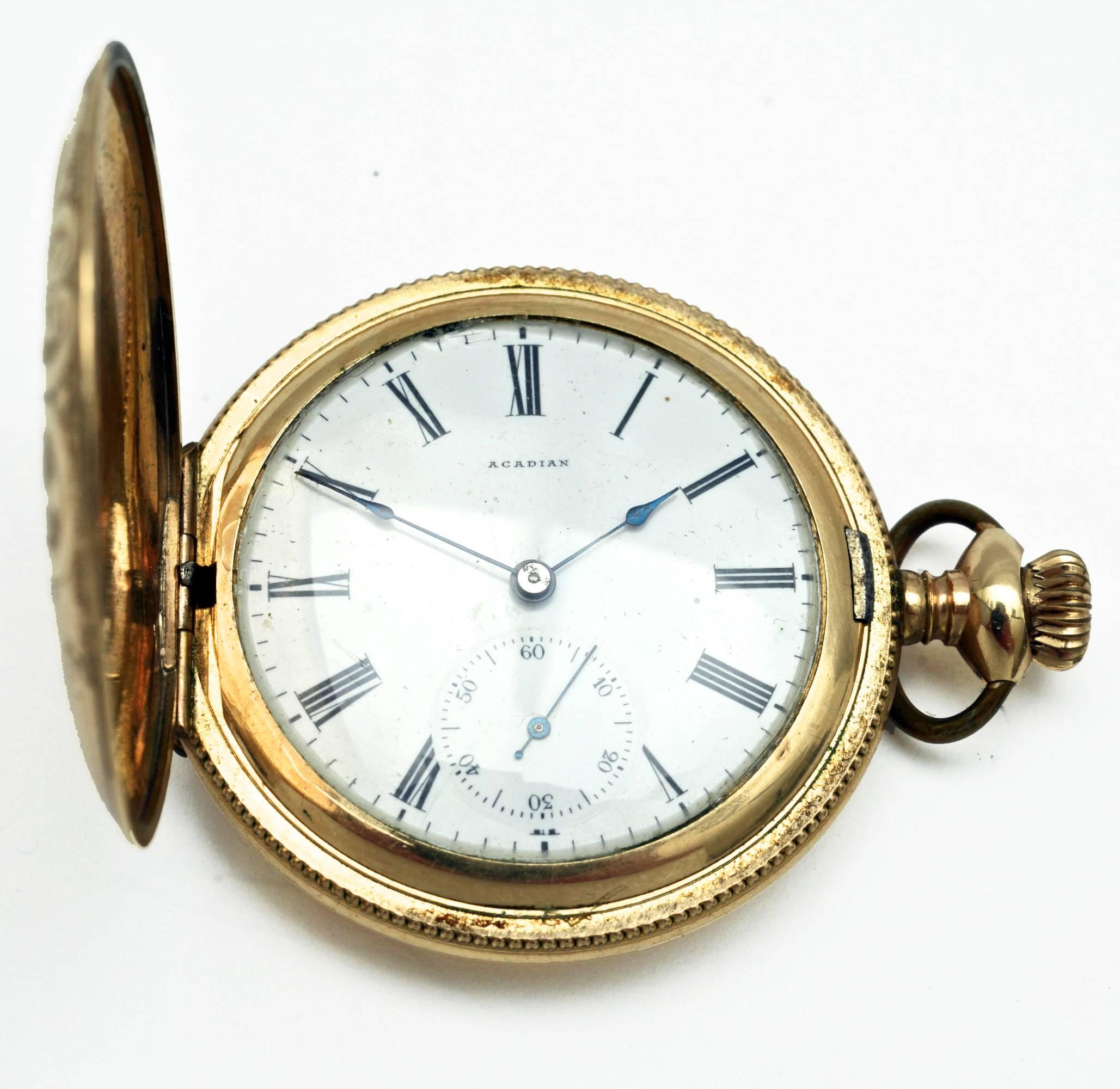 Vintage Arcadian gold-filled pocket watch with engraved triple hunter case. The signed and numbered ''Monitor'' case opens to a dial with Roman numerals and separate sub-second hand. The case has a cartouche for initials that has never been