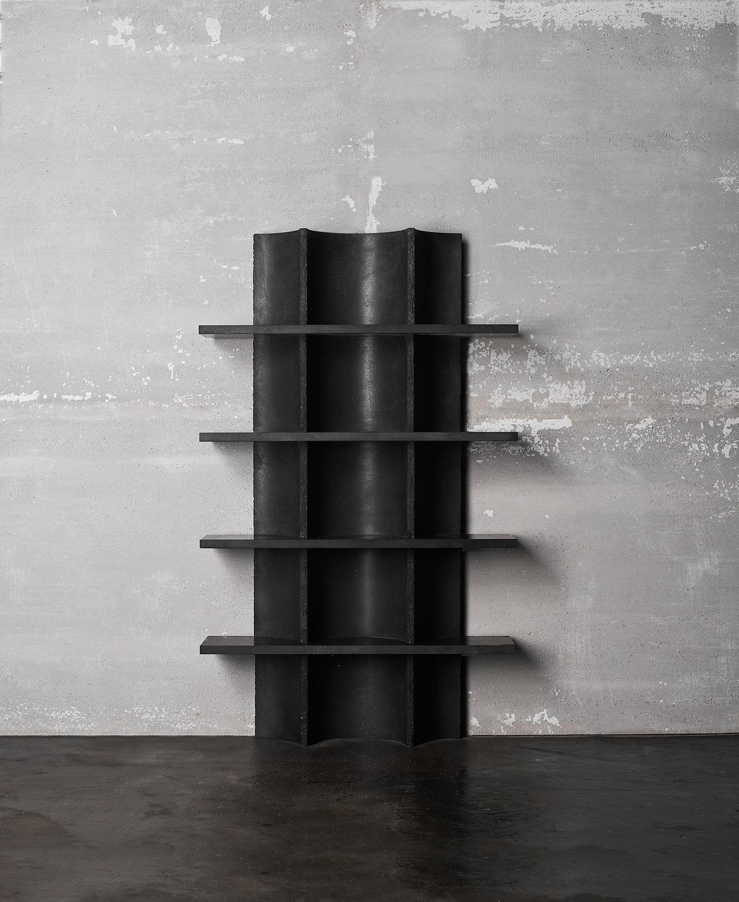 Arcaica Bookcase in Pietra Lavica Marble by Bufalini Marmi
Dimensions: D 27 x W 110 x H 180 cm. 
Materials: Pietra Lavica marble.

The shape of the structural modules composing this bookcase stems from its manufacturing method: by drilling just