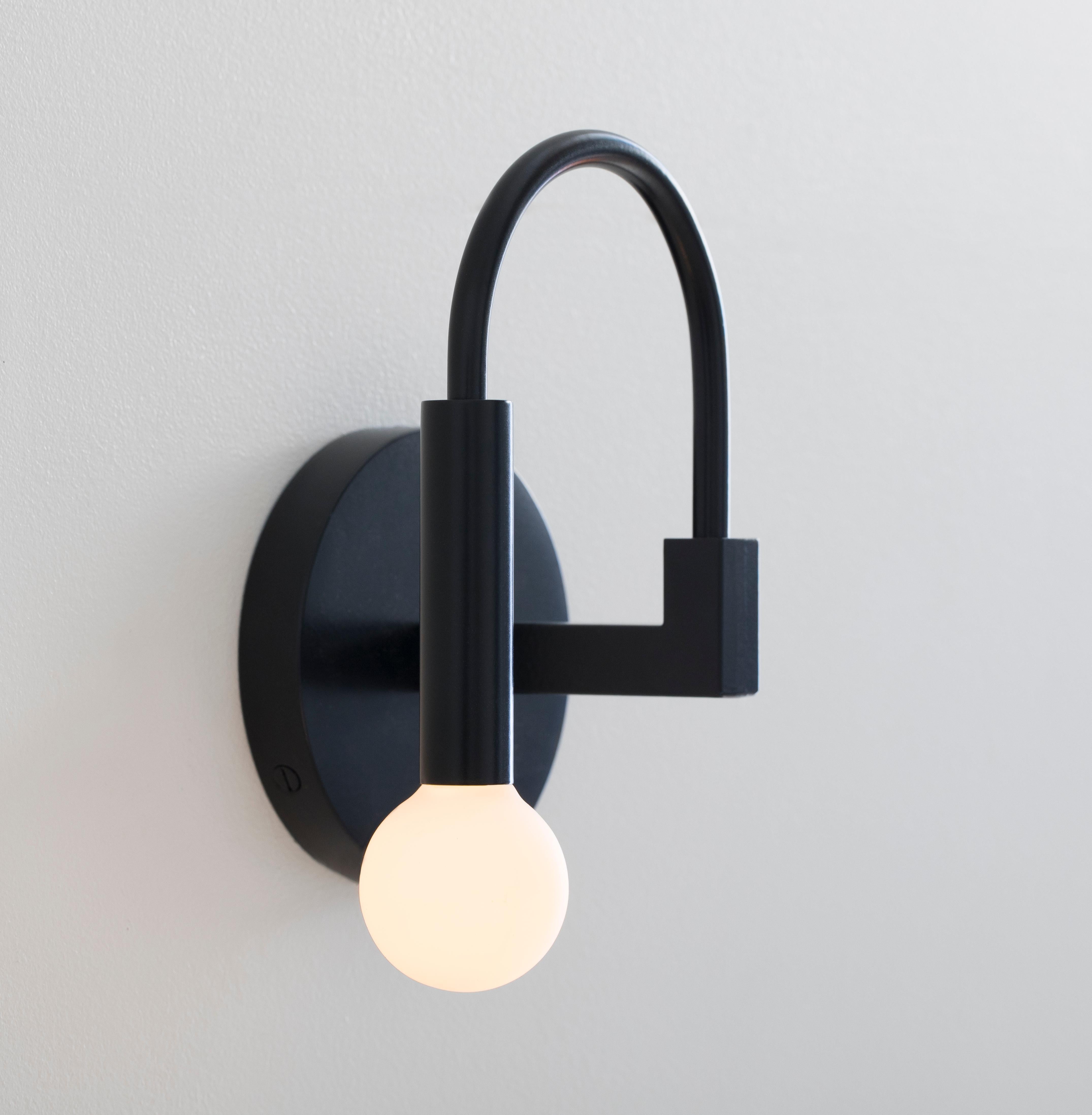 Arch

Arch draws on the elemental forms of Roman architecture to create a playful yet timeless sconce, blurring the line between traditional and contemporary design.

Details:
This listing is for one arch wall sconce in matte black with satin