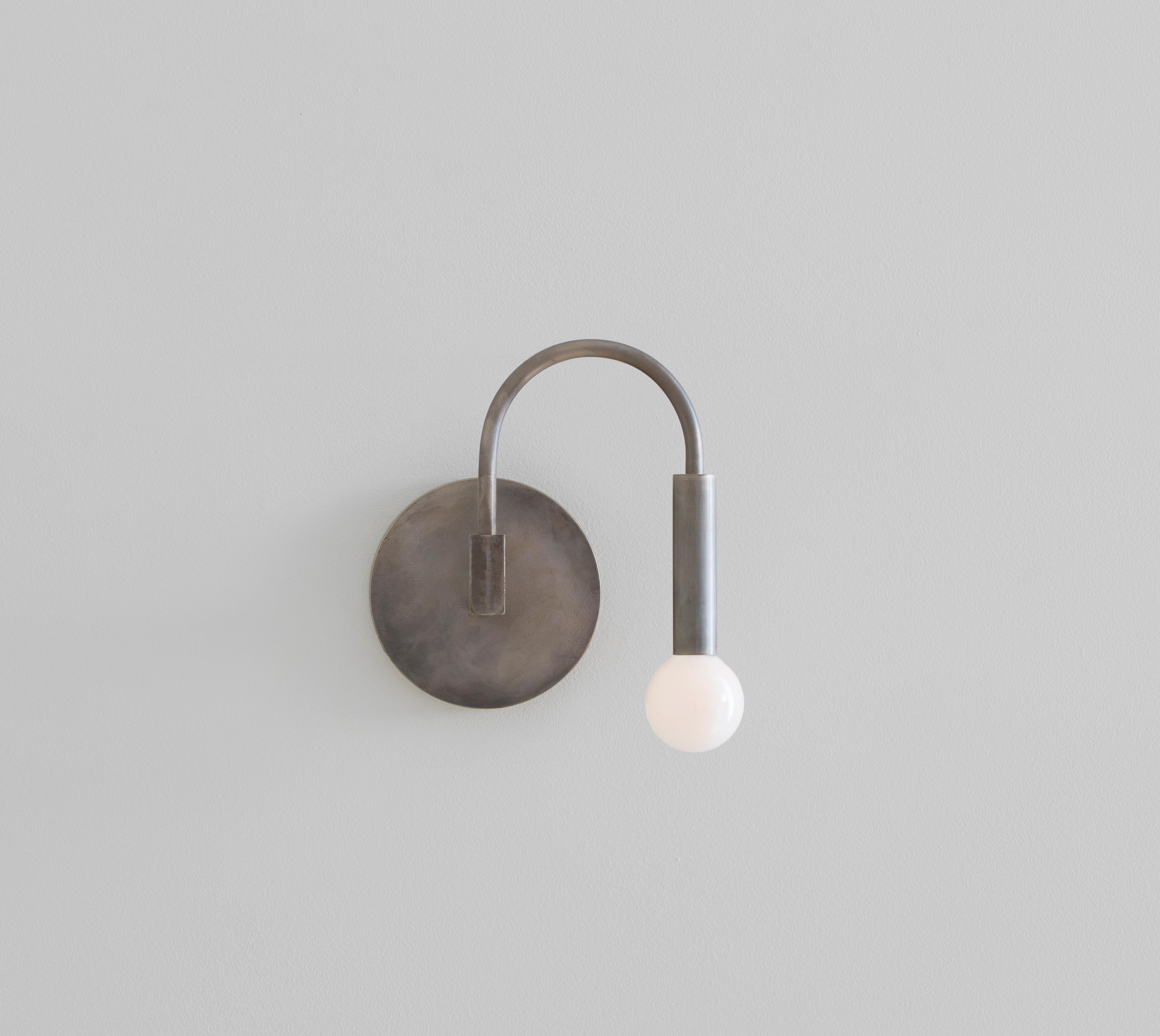 Minimalist Arch, a Contemporary Wall Sconce in Matte Black with Satin Glass Globe, ADA For Sale