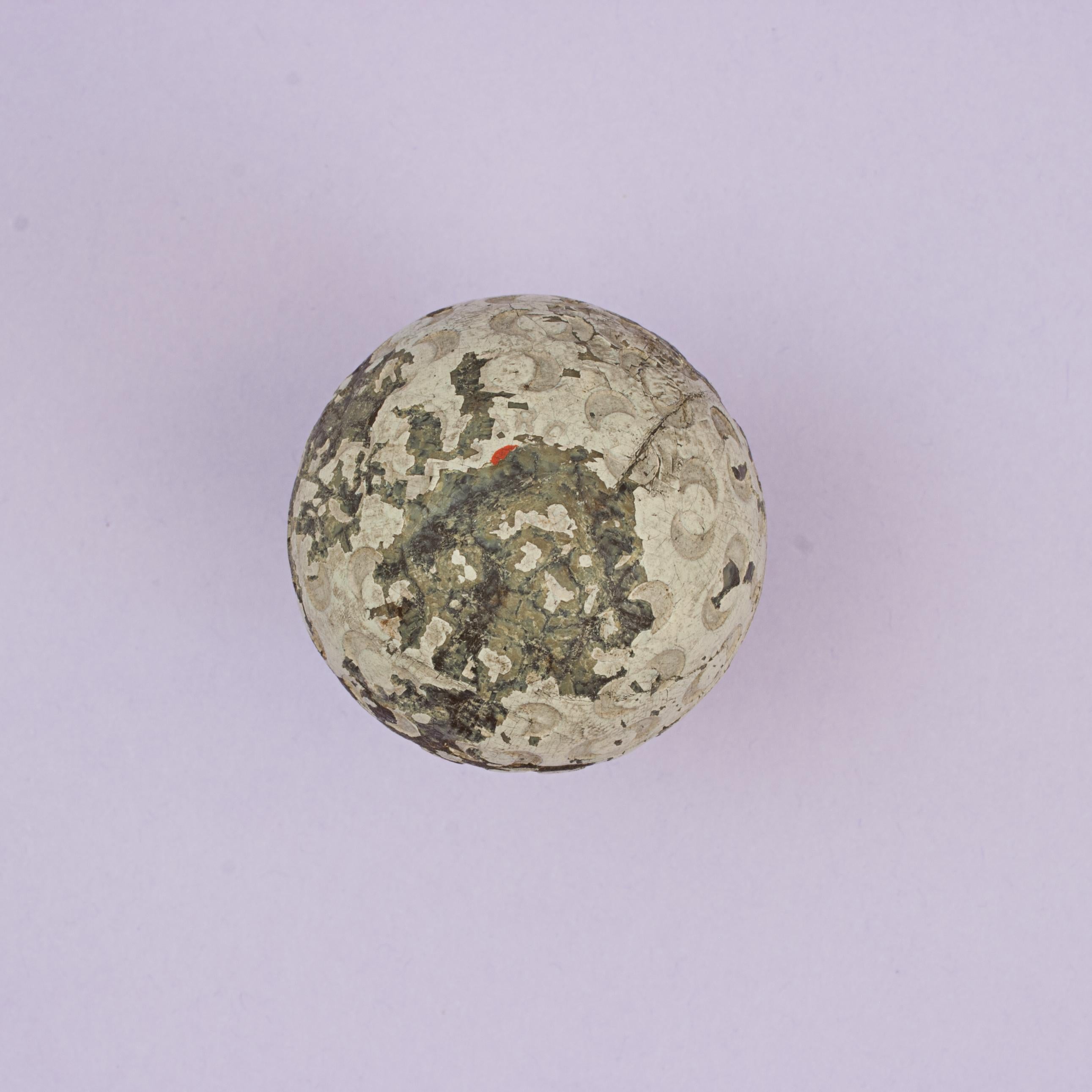 St. Mungo's 'Arch Colonel' Rubber Core Golf Ball.
An unusual patterned rubber core golf ball in fair condition manufactured by St. Mungo Manufacturing Co. of America, Newark, New Jersey and Glasgow. The ball is named 'Arch Colonel' on both poles (a