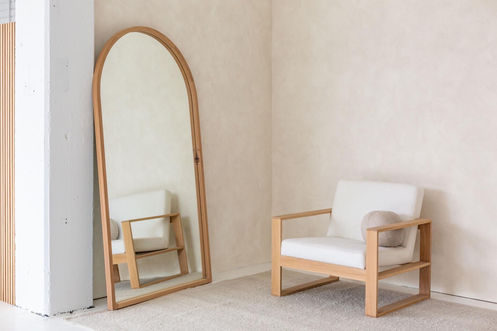 The Arch mirror is beautifully simple, handmade and curved with solid wood, this piece will add a warmth and minimalist sophistication to any interior. Featured here in American oak, this full length mirror is available in a range of timbers and