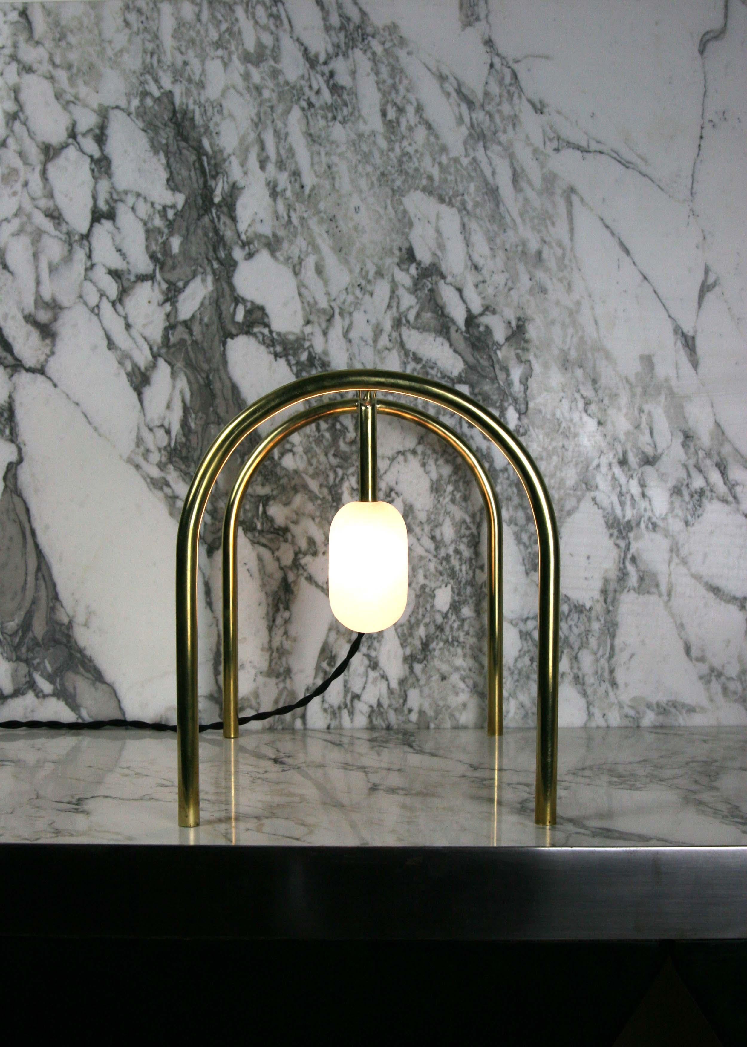Arch lamp by Krzywda
Dimensions: 30L x 25D x 21H cm
Materials: Alabaster, brass
Versions variable: Tulip, tear, oblong, sphere diffuser.

Individually handmade in France by Krzywda. 

Krzywda (pronounce 