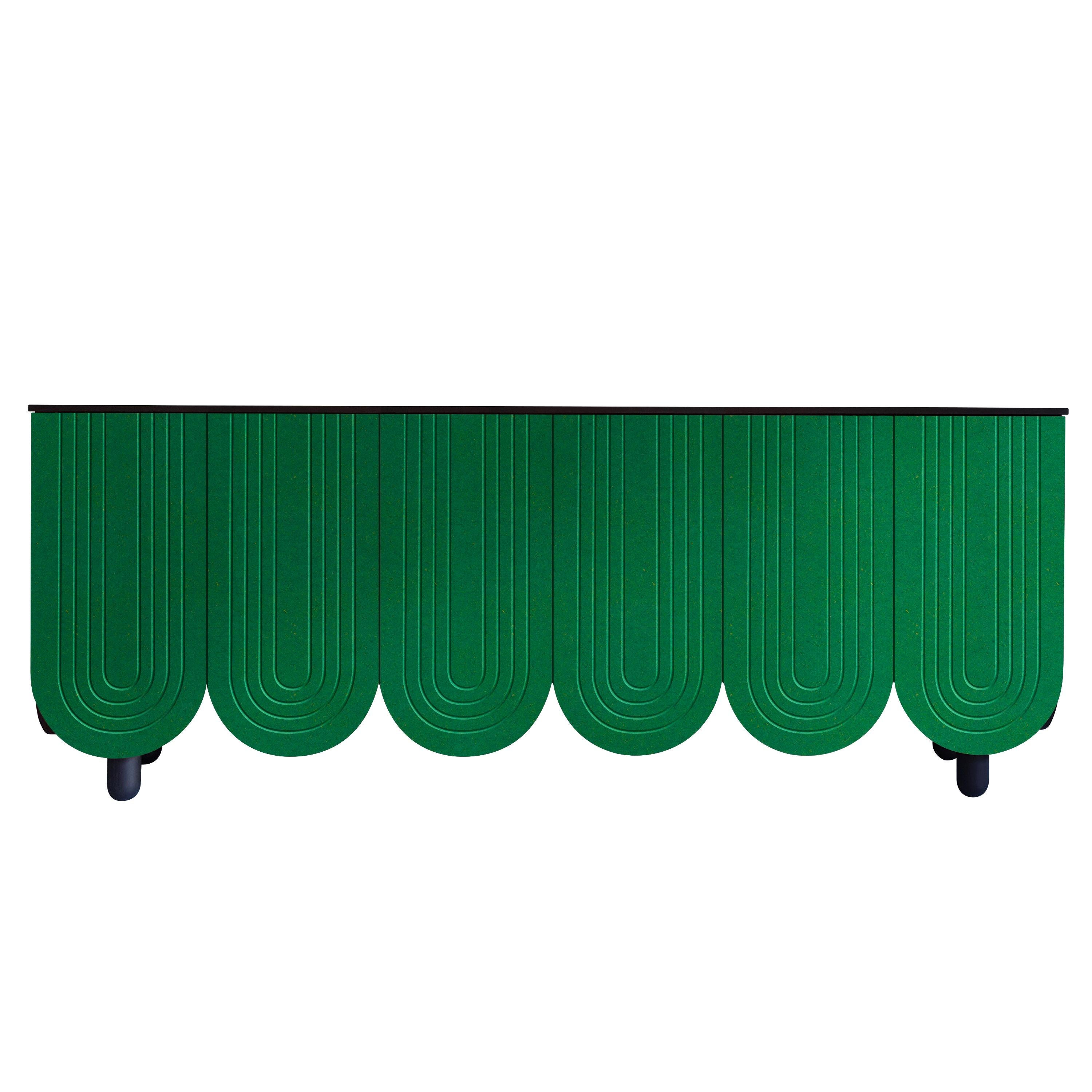 A series of Arch Cabinets made in a choice of chocolatey Brown, Emerald green or bright Blue.

The elegant 6 door version plays with the Arch shape and mirrors it in a series of grooved arches on the doors and sides.
These pieces are quite