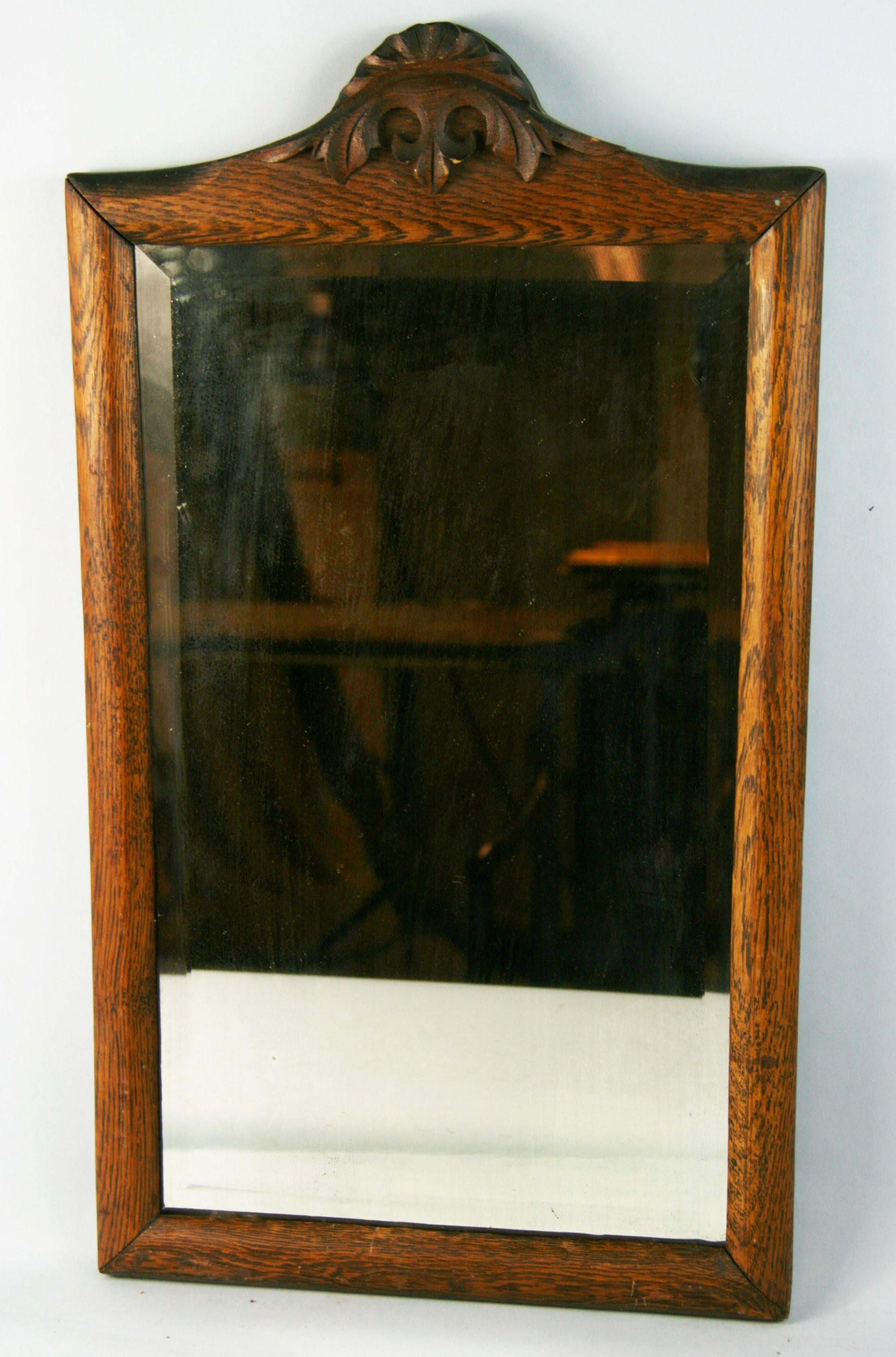 3-664 Arch top beveled glass oak mirror.