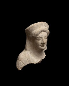 Archaic Greek Terracotta Bust of a Young Woman (Kore)
