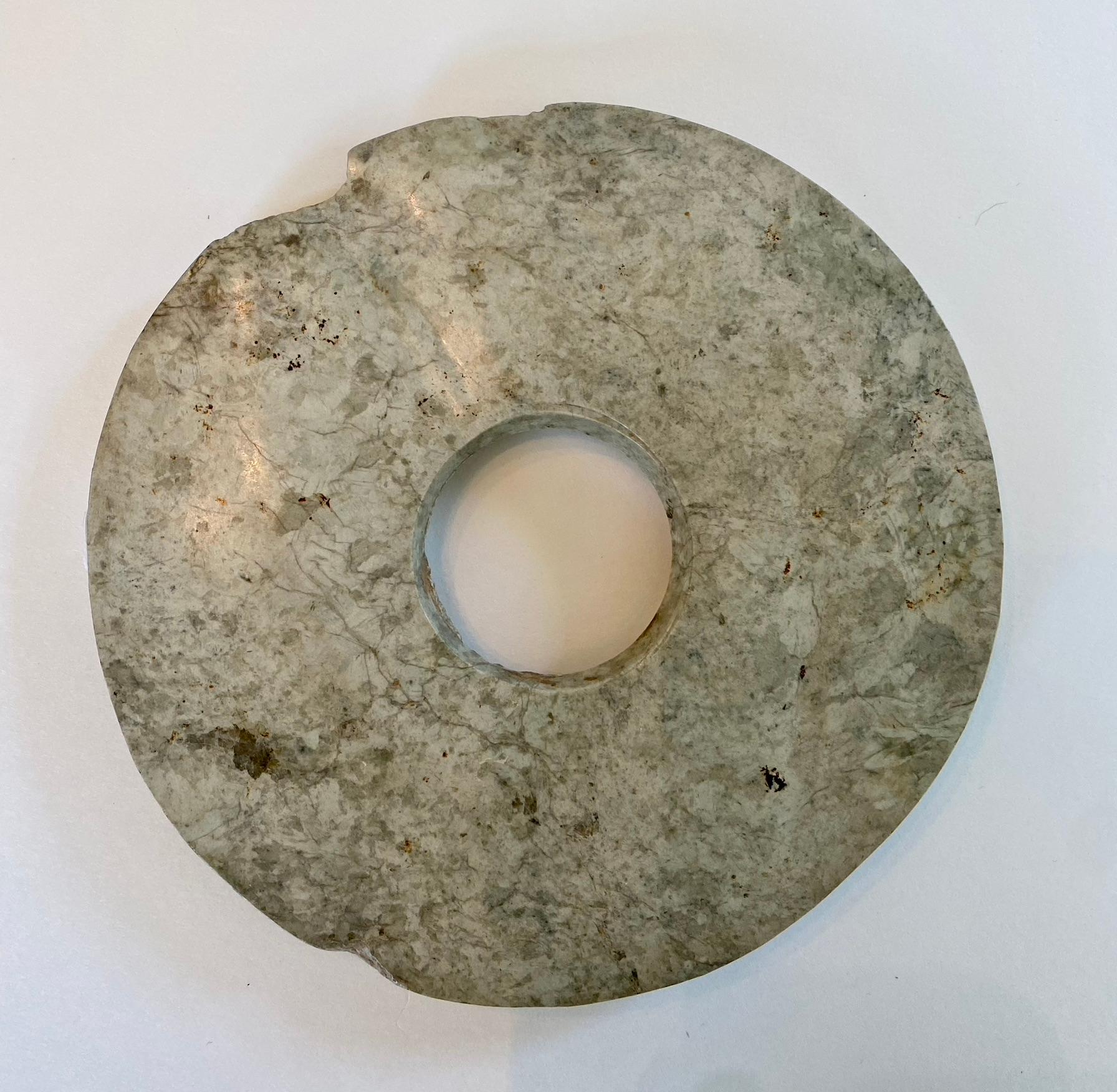 Museum-quality Chinese jade Bi from the Liangzhu period (3300-2200 BC).  For the Liangzhu, jade was the primary material through which the secular and religious authority of its leaders was expressed. 

Jade Bi discs, which are believed to 