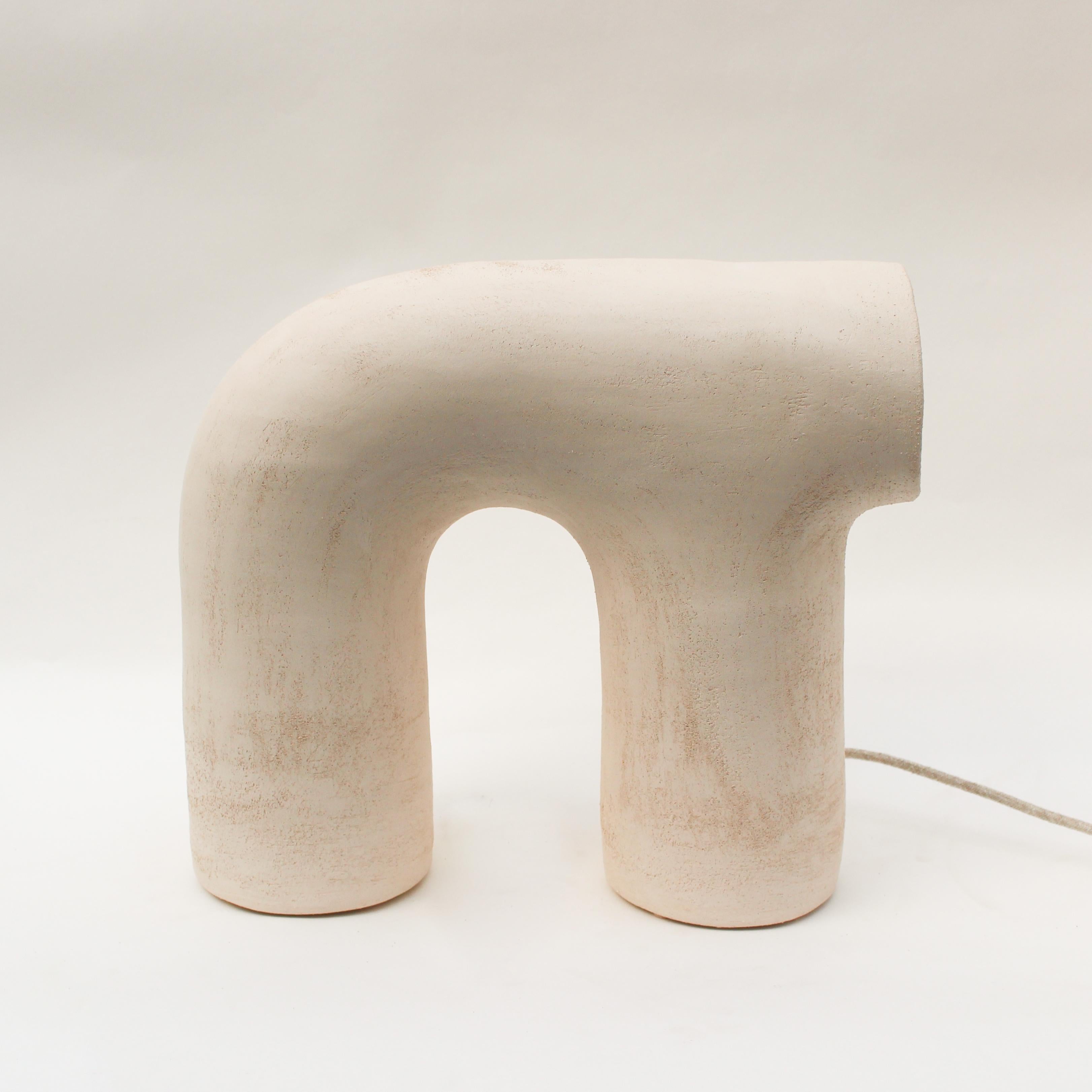 Arche #3 White Stoneware Lamp by Elisa Uberti
Dimensions: D35 x W23 x H35 cm
Materials: Stoneware
Also available in: white/pinck or black Stoneware.

All our lamps can be wired according to each country. If sold to the USA it will be wired for