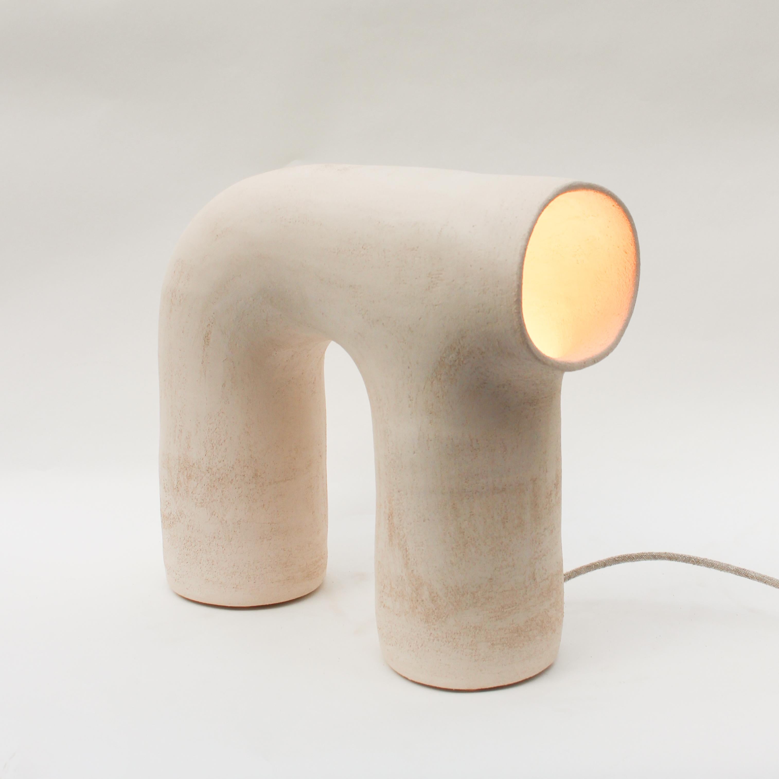 Arche #3 white stoneware lamp by Elisa Uberti
Dimensions: D55 x W23 x H55 cm
Materials: Stoneware
Also available in: white/pinck or black Stoneware.

All our lamps can be wired according to each country. If sold to the USA it will be wired for