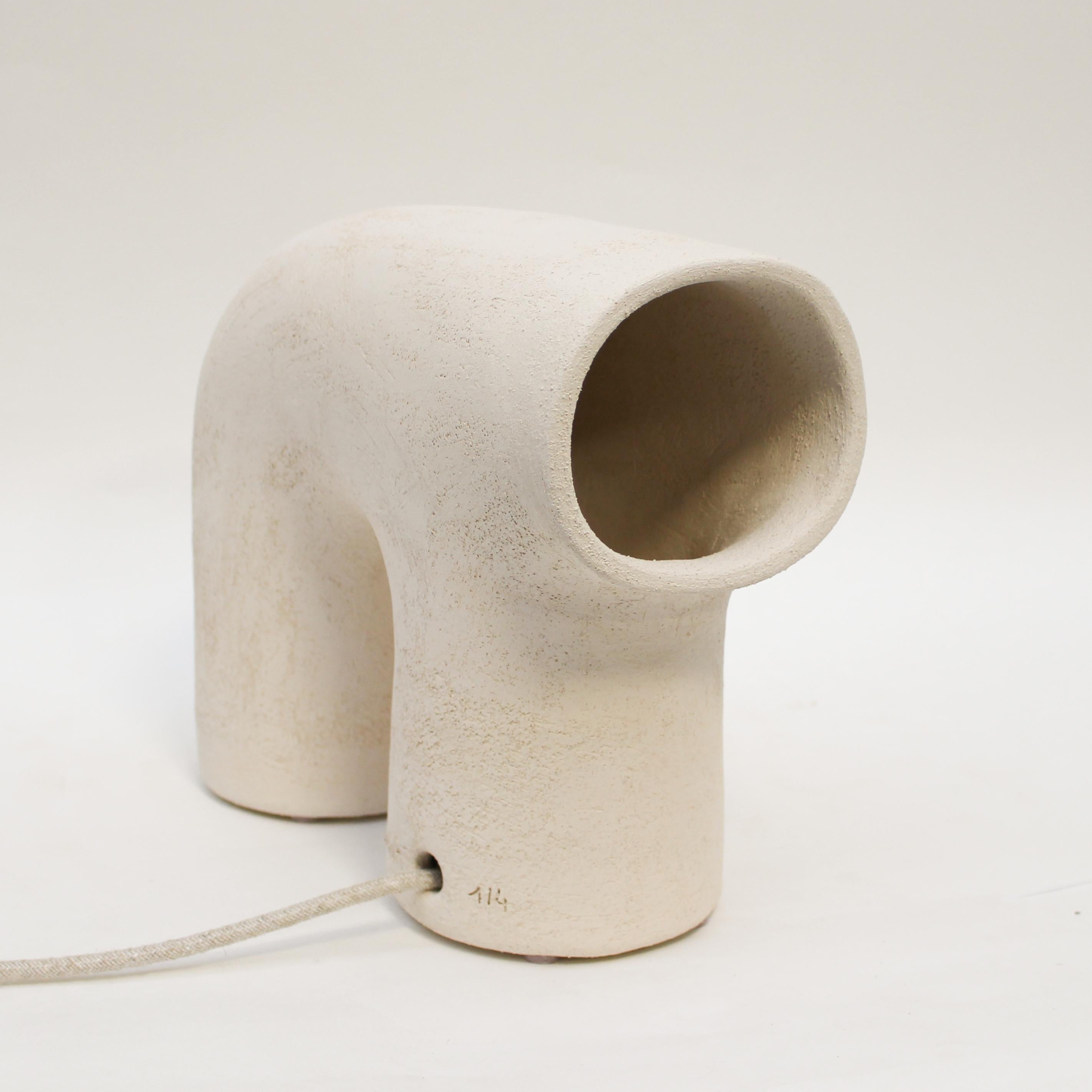 Arche #5 stoneware lamp by Elisa Uberti
Dimensions: D 10 x W 20 x H 25 cm
Materials: white stoneware.
This product is handmade, dimensions may vary.


All our lamps can be wired according to each country. If sold to the USA it will be wired