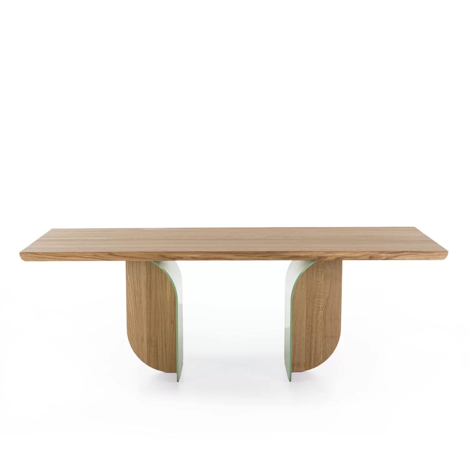 Dining Table Arched with solid oak top with glued slats, top with
rounded corners. Base with 2 feet in solid oak and 2 feet in steel
in green lacquered finish.
Also available on request in solid walnut wood.
Also available on request with steel feet