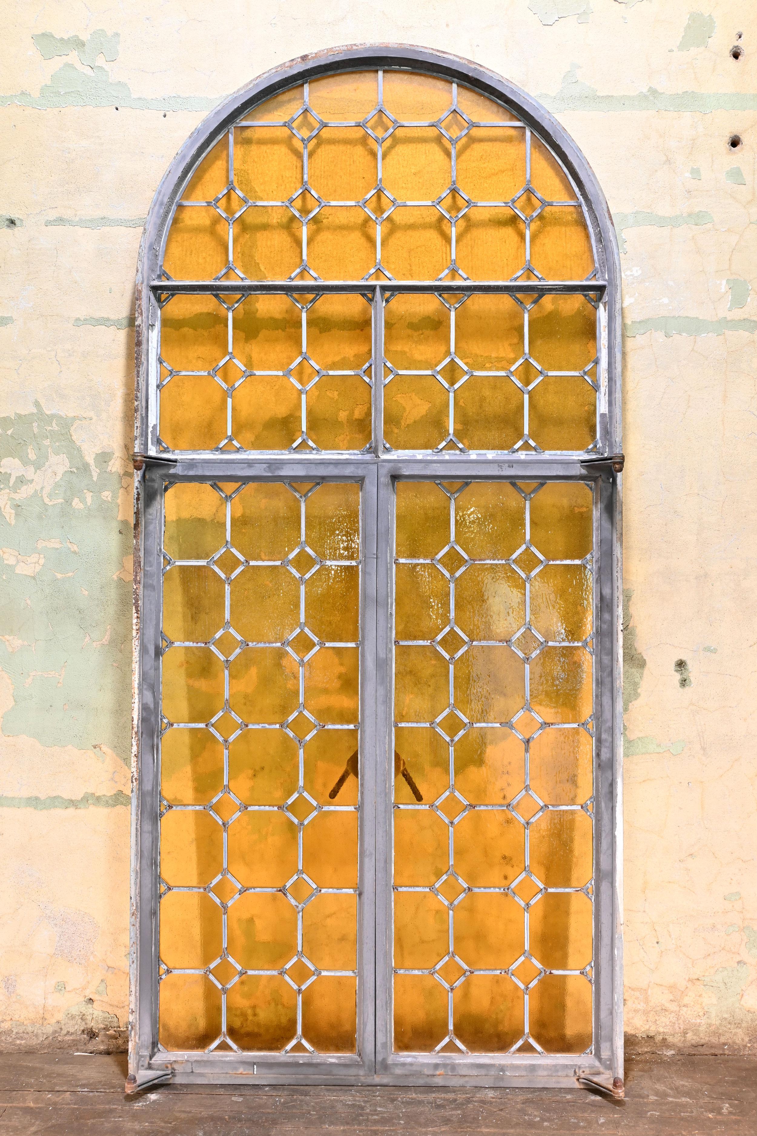 20th Century Arched Iron Framed French Window with Yellow Glass For Sale