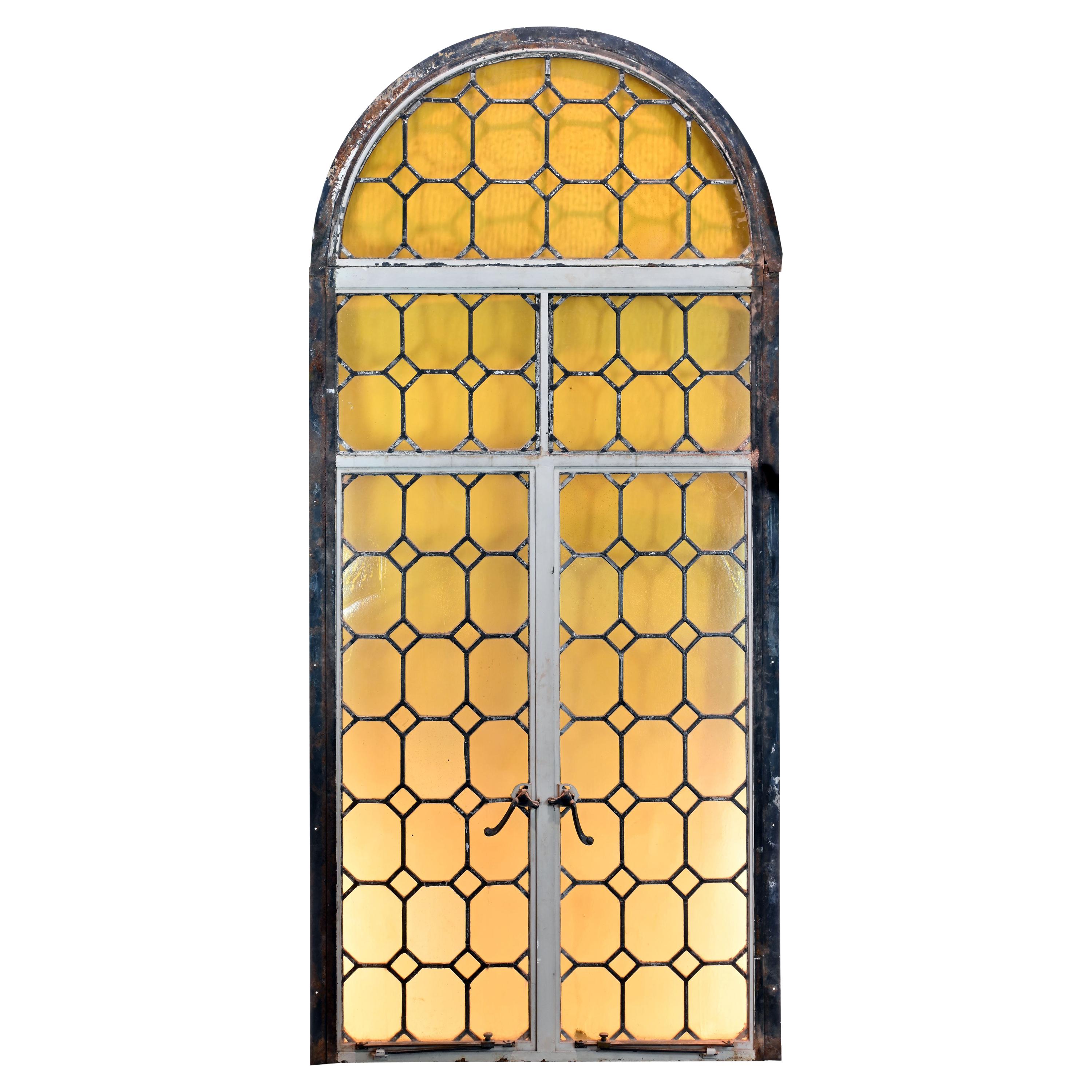 Arched Iron Framed French Window with Yellow Glass For Sale