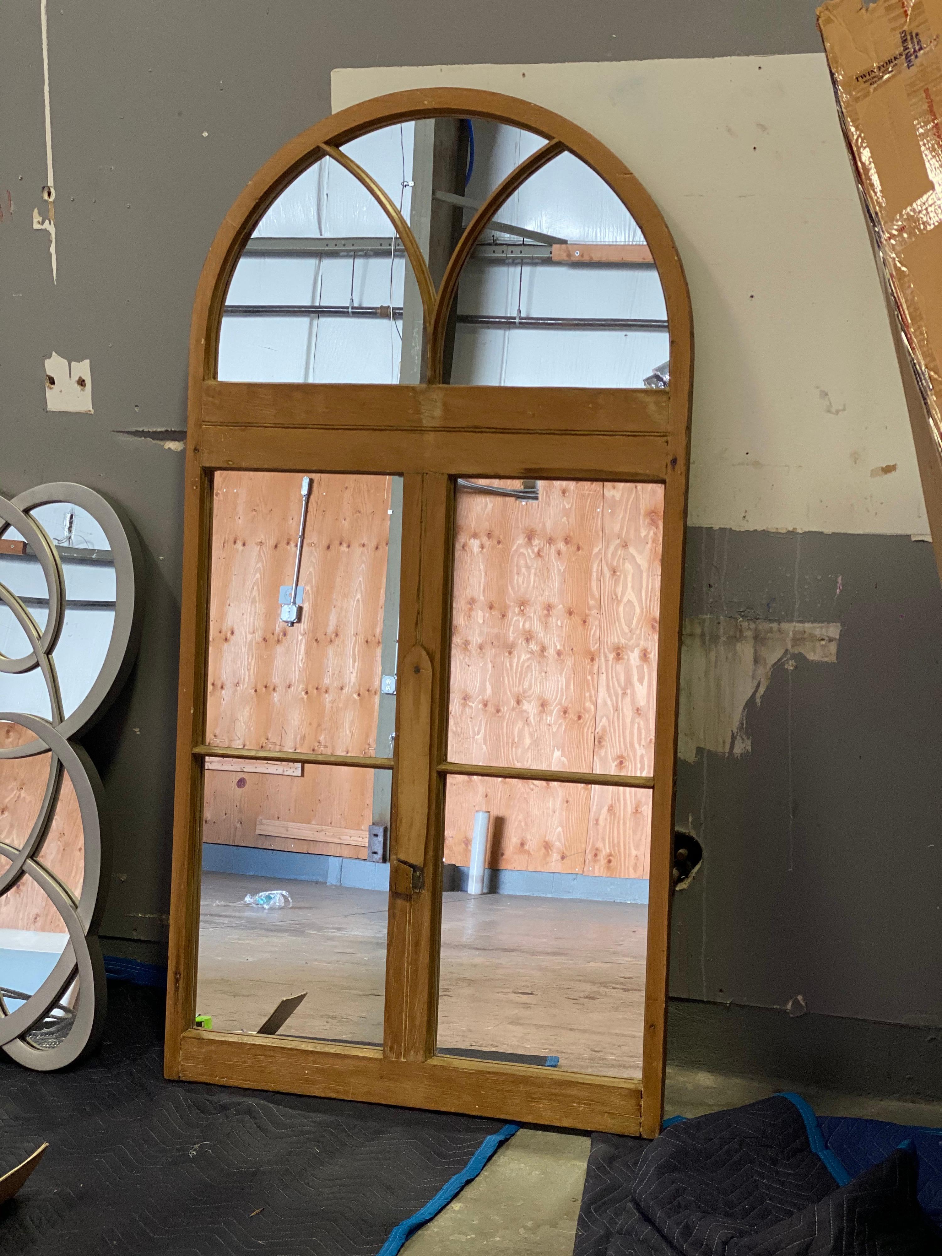 Arched pine architectural full length mirror. Center wood slides open to reveal an open slot.
Measures: 1 3/8