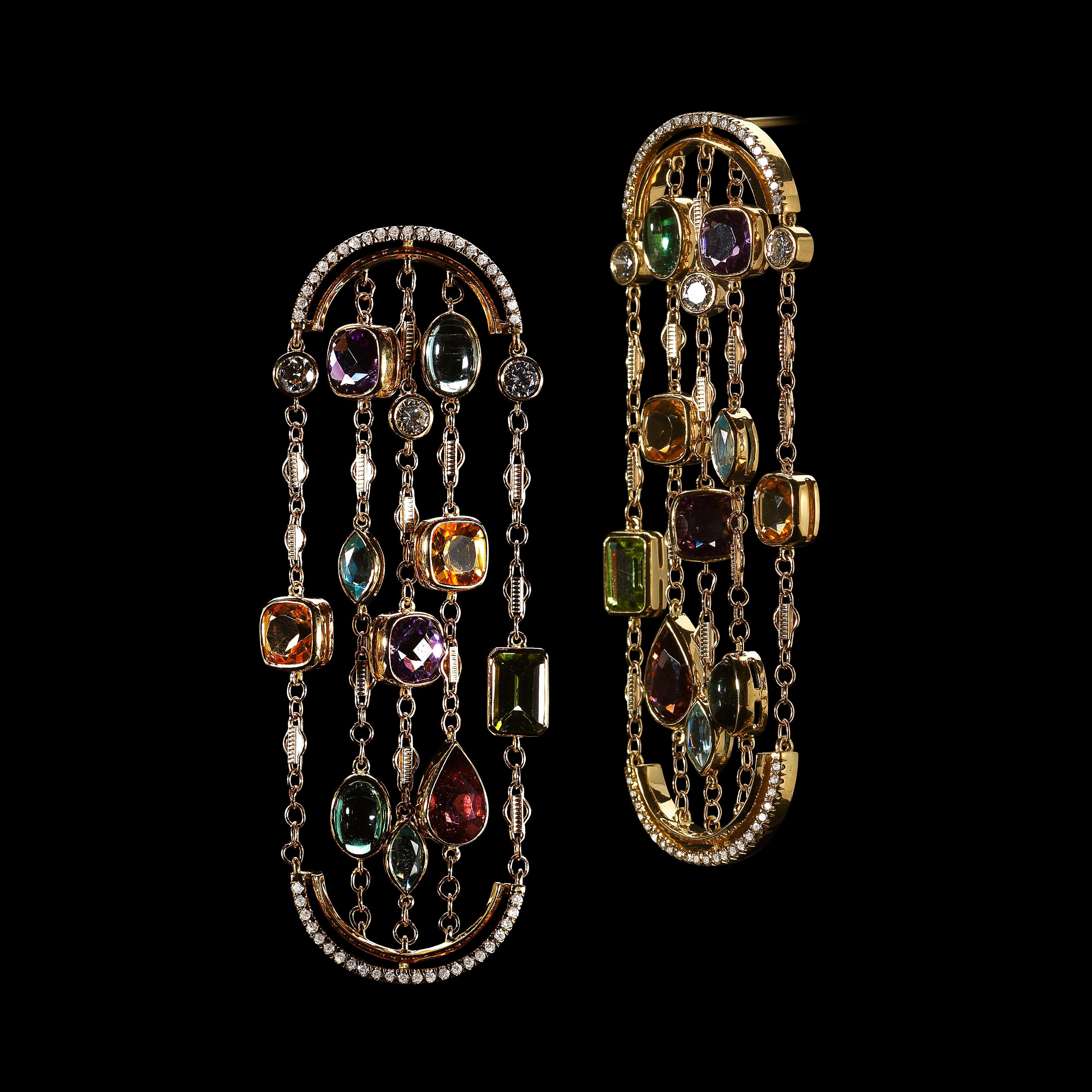 Diamond & Precious Stones Sautoir Arched Earrings set with a mixture of Brilliant-cut Diamonds and fancy shape Aquas, Citrines, Green cabochon and six 5mm snowflake charms set with melee diamonds. Each earring suspended by Alexandra Mor signature