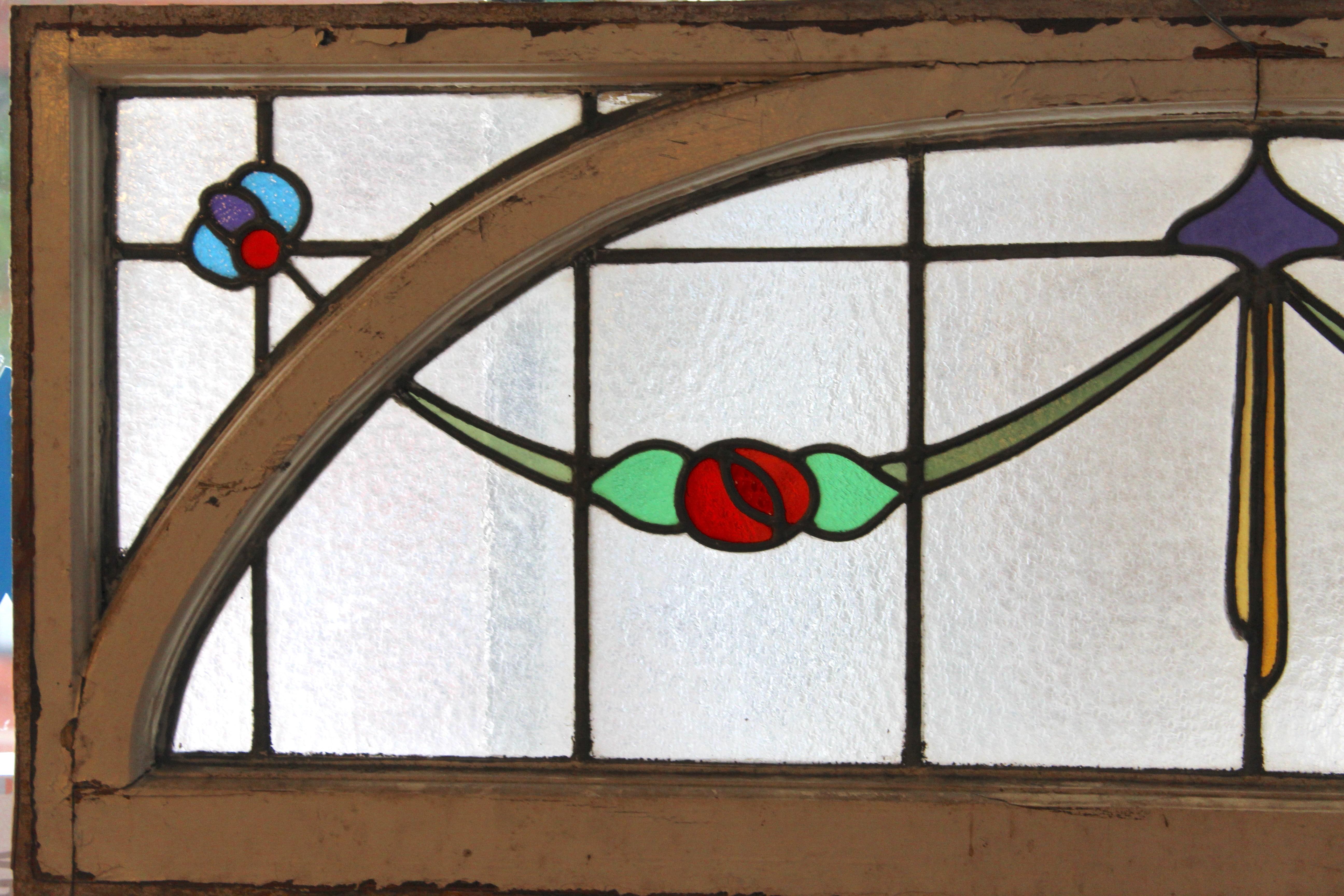 Transom window with stained glass designs and arched frame. Great for above your door or an inside doorway.
Currently housed in a wooden frame - the overall dimensions are for the stained glass and the frame.
Located in NY