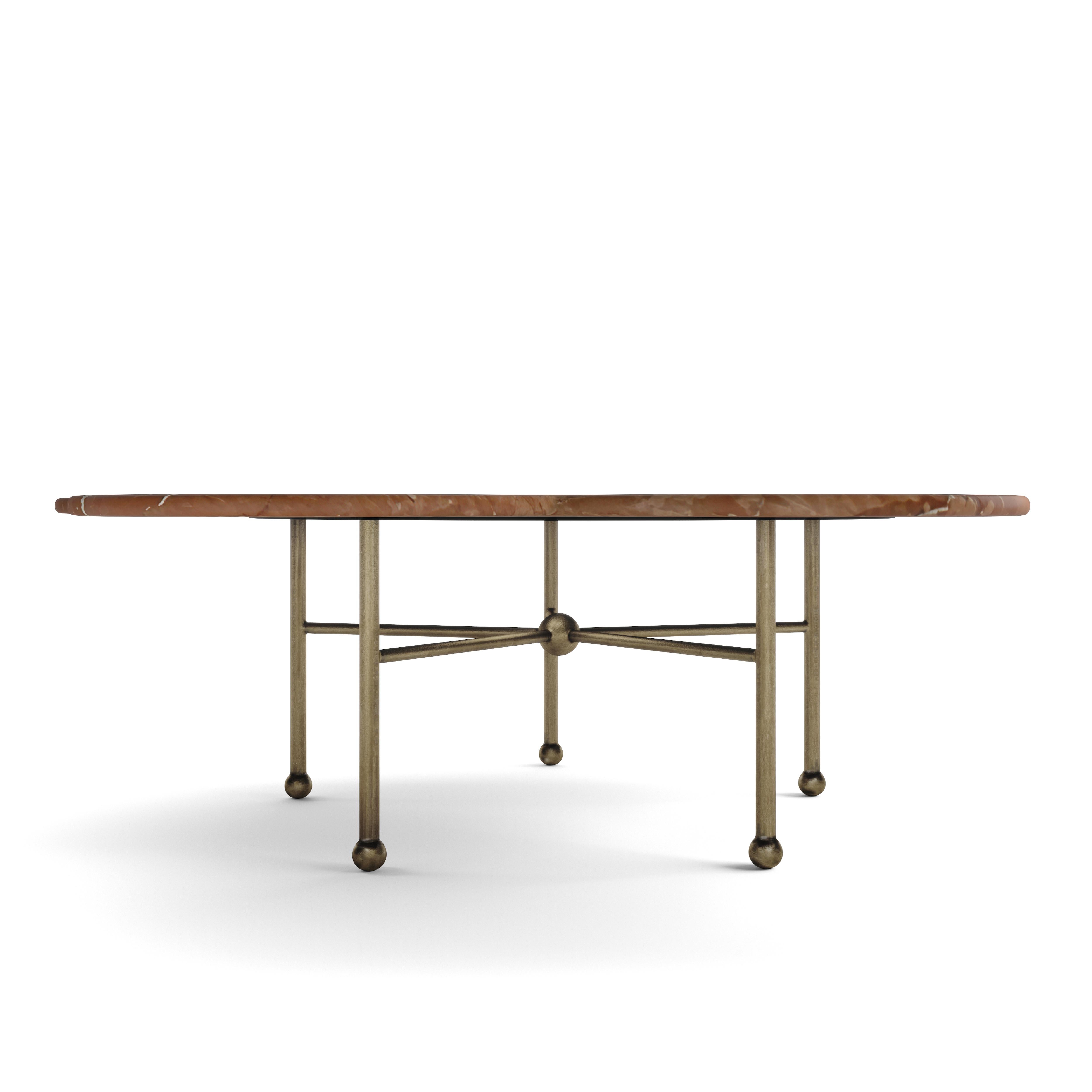 Hand-aged brass pairs with curvilinear rojo marble in our showstopping Archer Table. Statement essentials make everyday life special & our Archer Table is a room-changer. We love this table in a laidback setting, imparting casual elegance with a