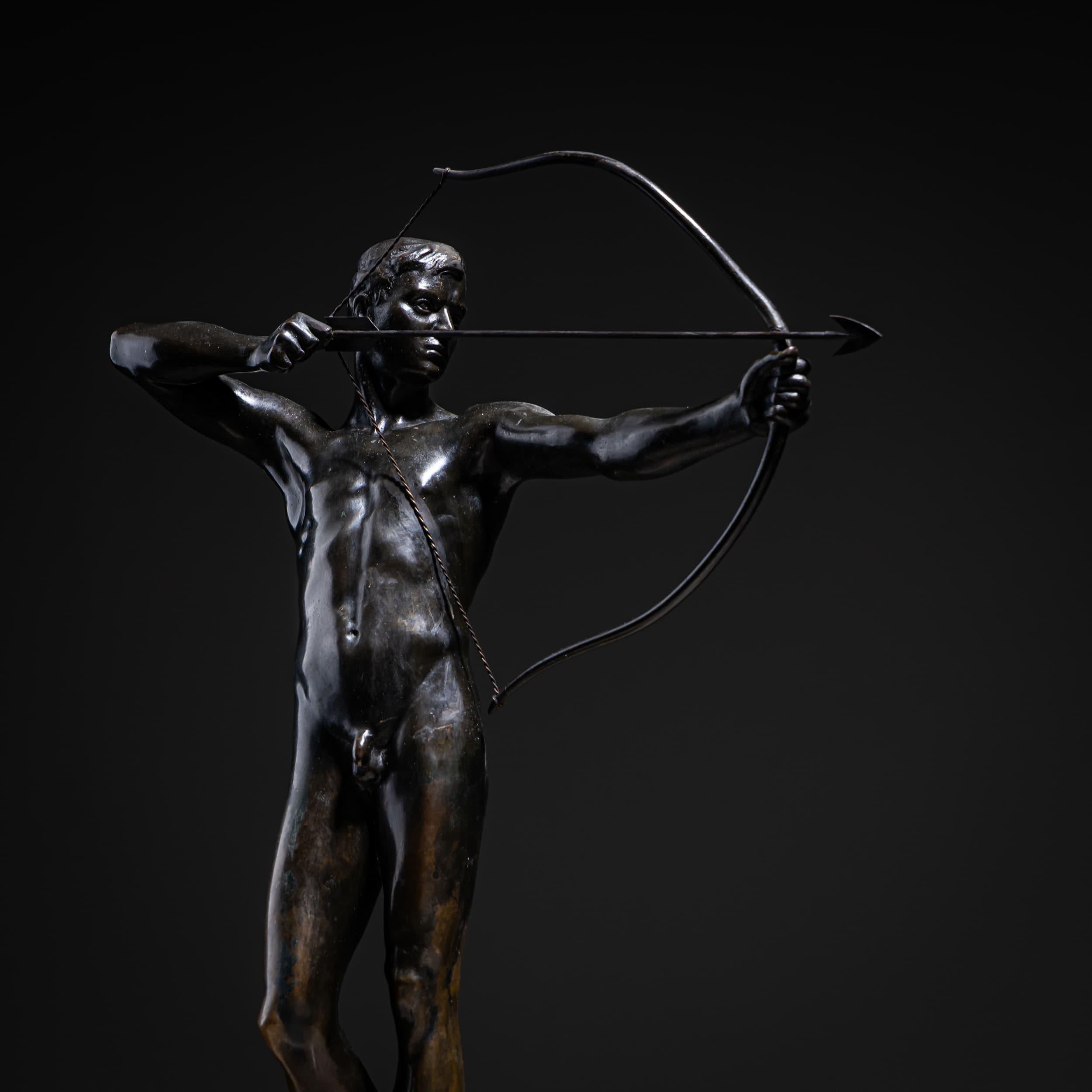 Finely executed bronze figure with green patina depicting a nude youth drawing a bow, by Paul Moye (1877 Nordhausen – 1926 Weimar). Mounted on a black stone base. Signed P. Moye on the plinth.