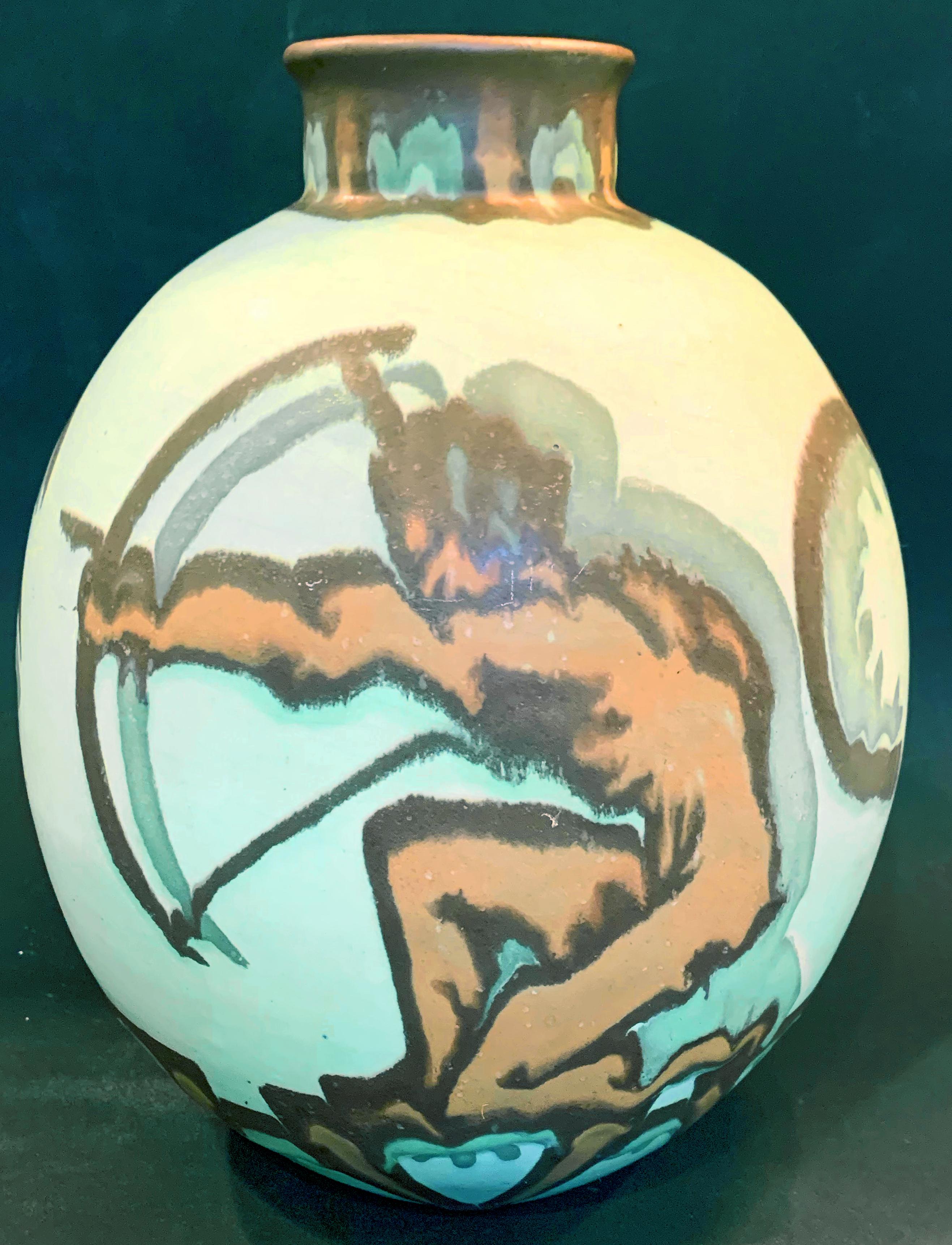 One of the most striking and unusual Art Deco pieces we have offered, this large, ovoid-shaped vase depicts a nude male Archer in tones of ruddy brown and black on a glowing sea foam green ground. The figure is painted with a heavy, dark outline