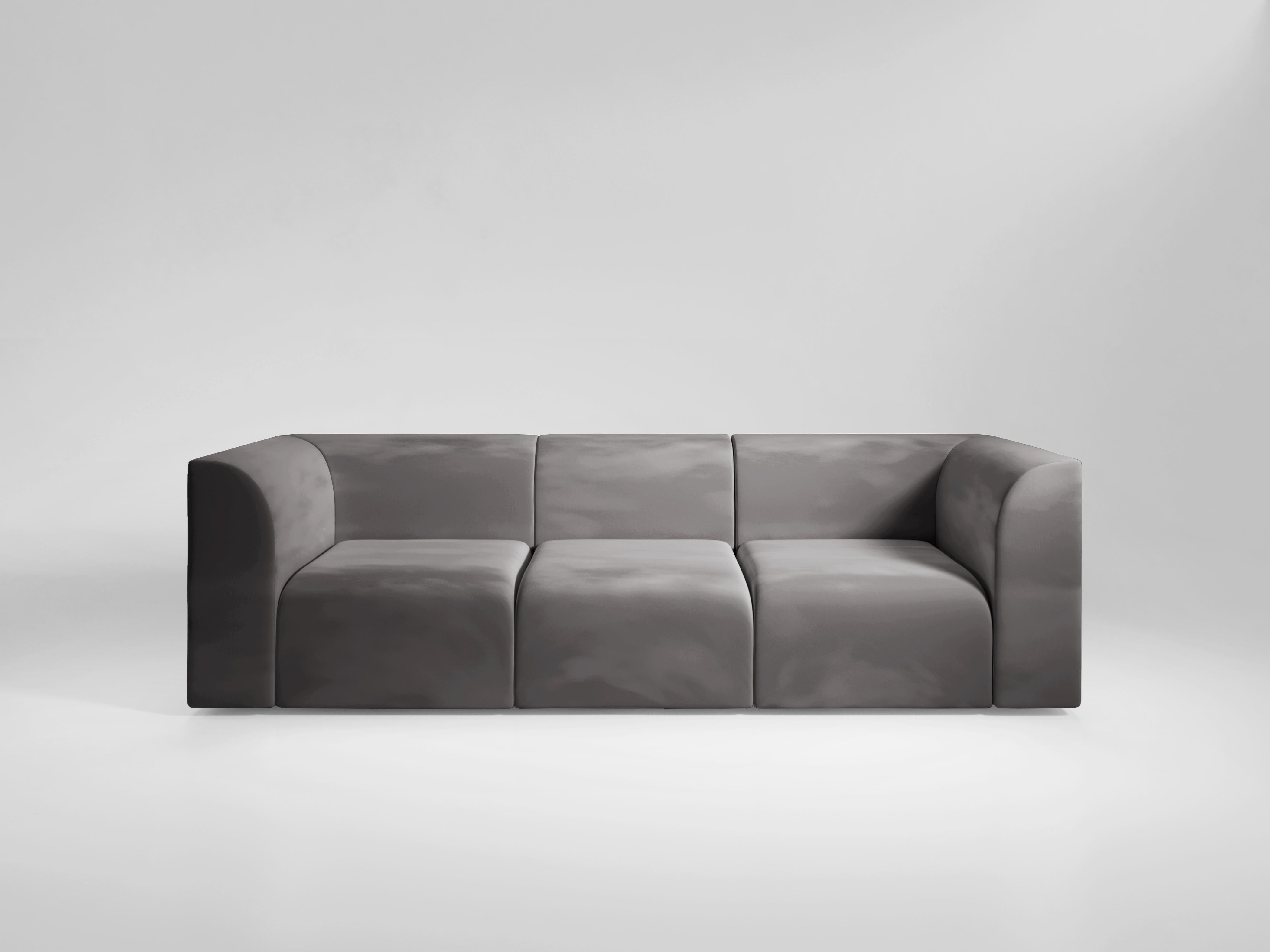 Ein modulares Sofa, das als Antwort auf ein Grundelement der romanischen Architektur entworfen wurde. Die Außenseiten sind quadratisch und scharfkantig, während die Innenecken glatt sind und sich nach innen wölben, so dass Sie den Komfort des