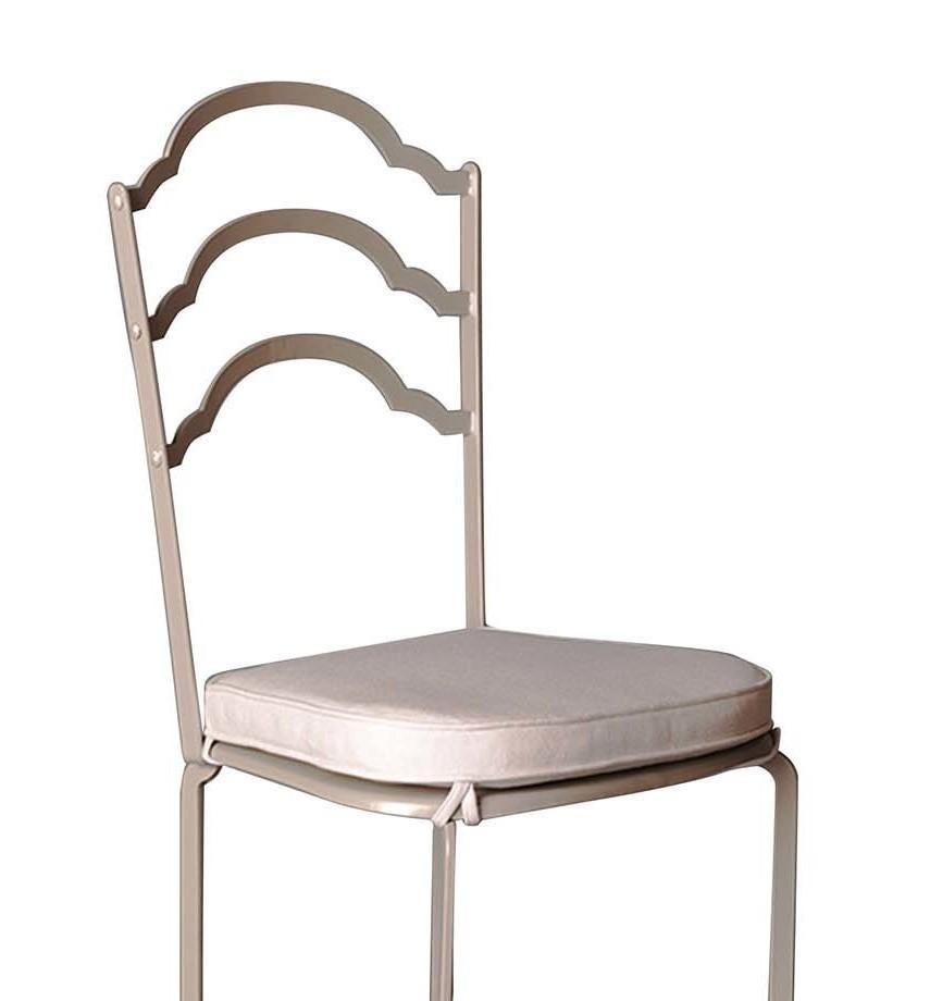 A superb addition to both indoor and outdoor areas, this chair will be a precious addition to a dining room, an accent piece in a study or entryway, or a versatile seating option on a terrace or poolside. Its linear silhouette is distinctive for its