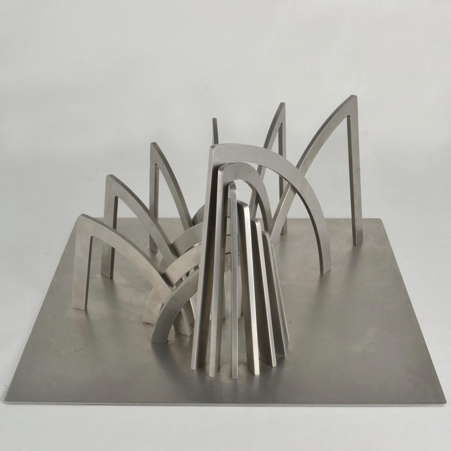 Monumental abstract sculpture in stainless steel by Margot Zanstra (Dutch, 1919–2010) stands on a brushed stainless steel base. This sculpture most likely is a model for an outdoor sculpture, the first step towards a commission that may have been