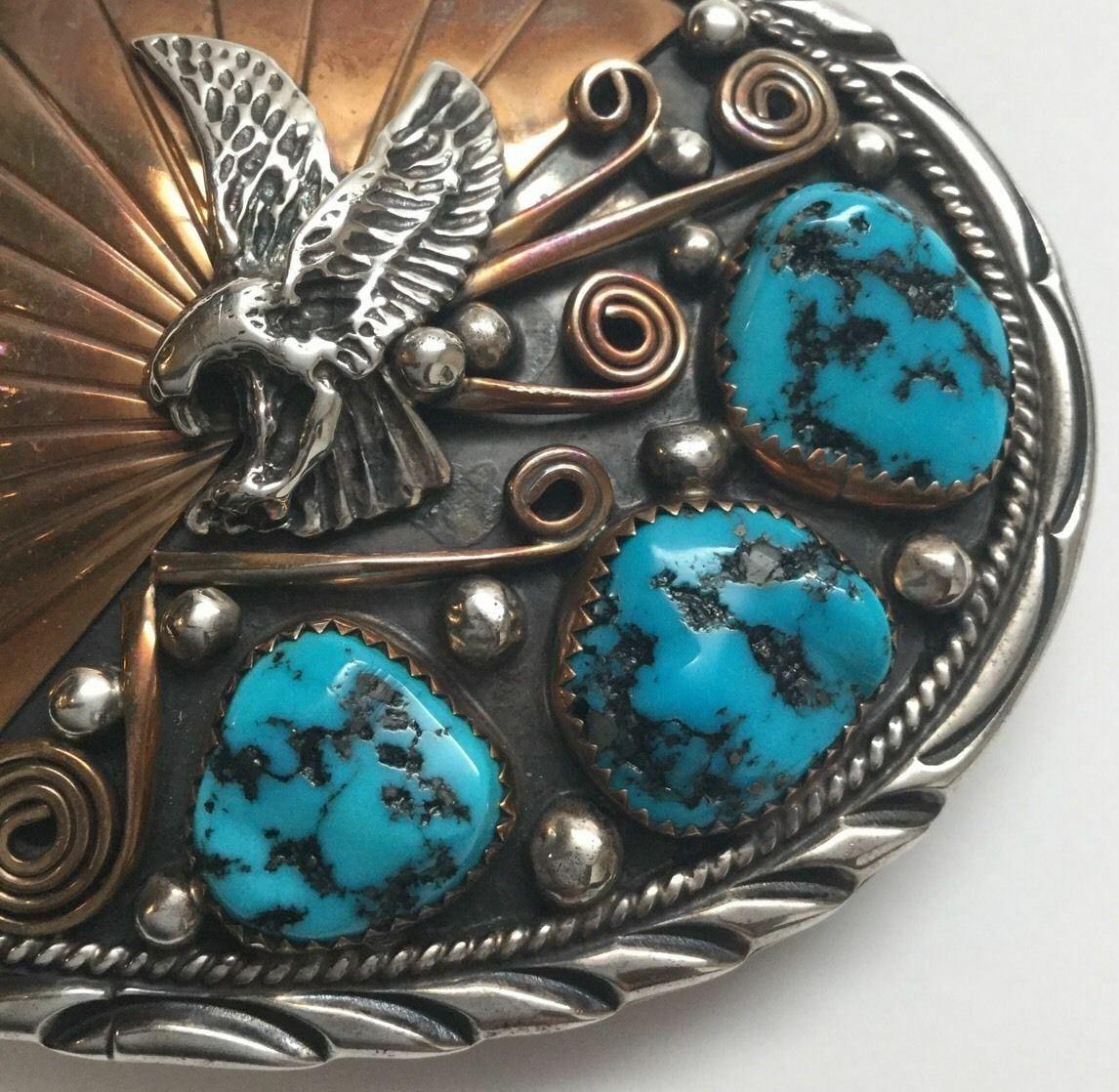 Native American Navajo Sterling silver and gold plated turquoise belt buckle by Archie Martinez.

Marked: STERLING, 1/20 12K GF.

Signed: A. Mtz.

Measures: 3 1/4