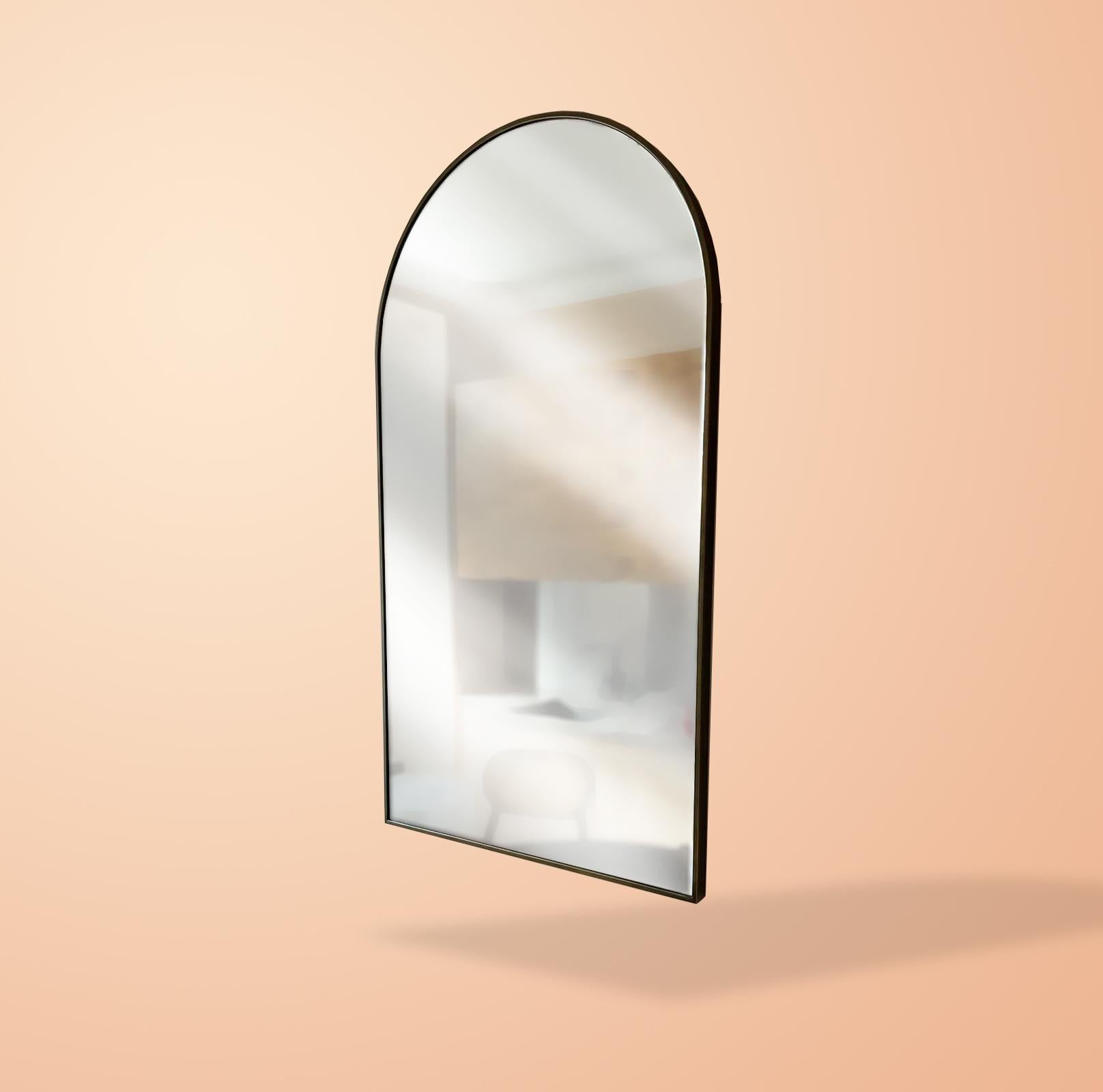 The Archie mirror is a clear mirror with a dark bronze finish metal frame.
It can be hung or it can just lean on the wall and be used as a dressing mirror.

The border of the frame is 20mm thick and 40mm deep. The depth of the mirror is used to hide