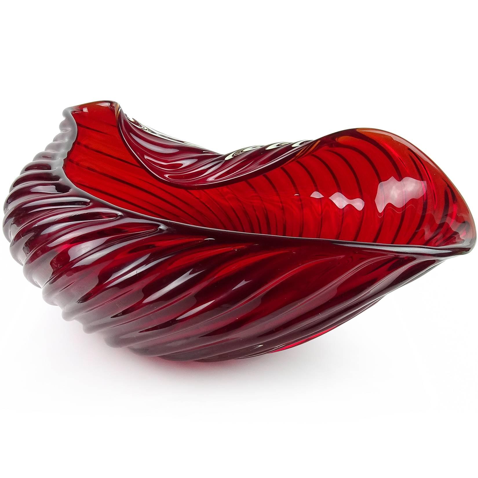 Rare and huge Murano hand blown ruby red art glass centerpiece bowl with ribbed design and biomorphic shape. Documented to designer Archinede Seguso, circa 1955, in the “A Coste