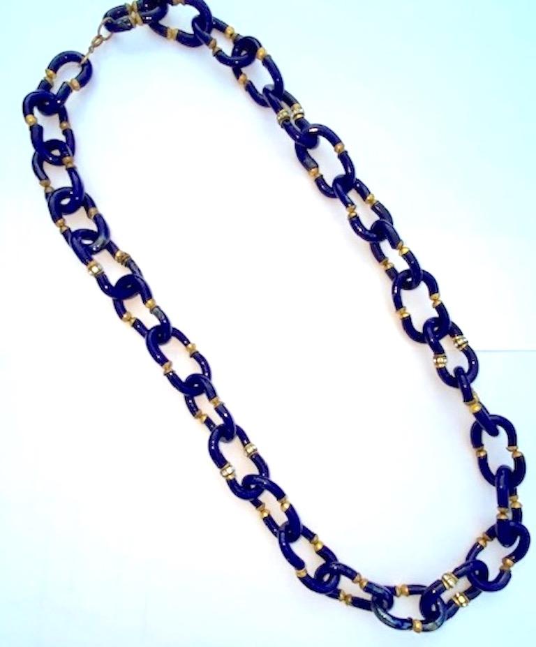 Lovely glass chain necklace by Archimede Seguso of Italy. Chain links are hand formed of two C shape glass pieces. The necklace is 29 inches long and .75 of an inch wide.